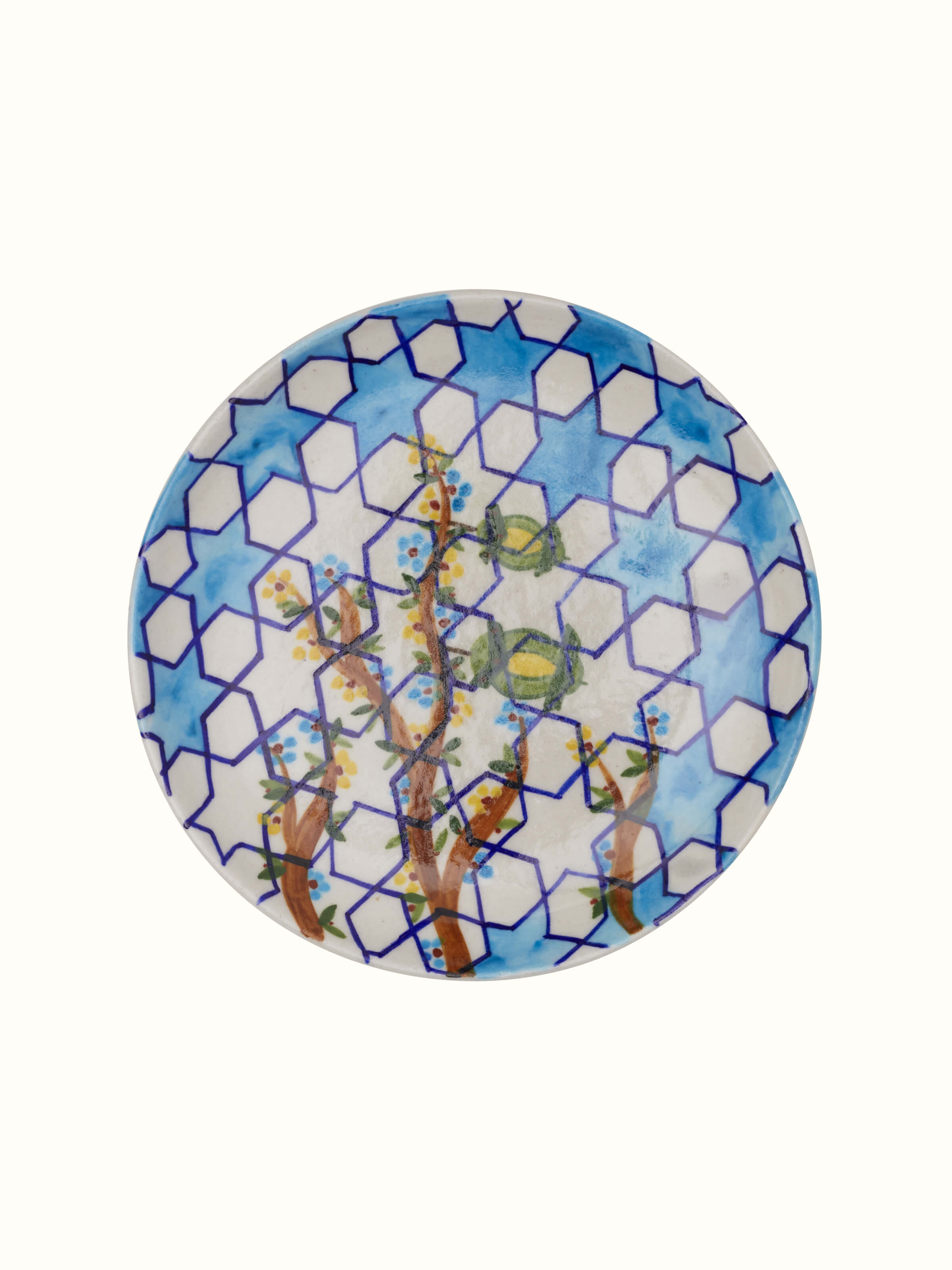 Angle view of Blue Pottery Hexagonal Pattern Display Plate by Swadesh showing off the bright colors and geometric pottery design.