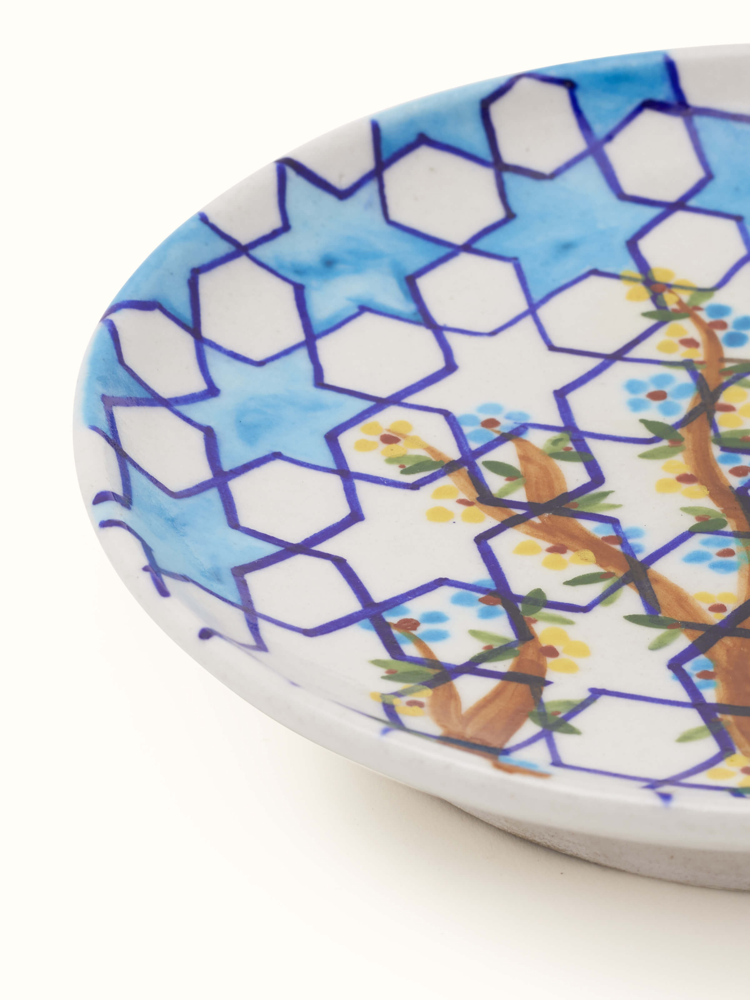 Detailed view of Blue Pottery Hexagonal Pattern Display Plate by Swadesh highlighting the unique texture and craftsmanship of the pottery.