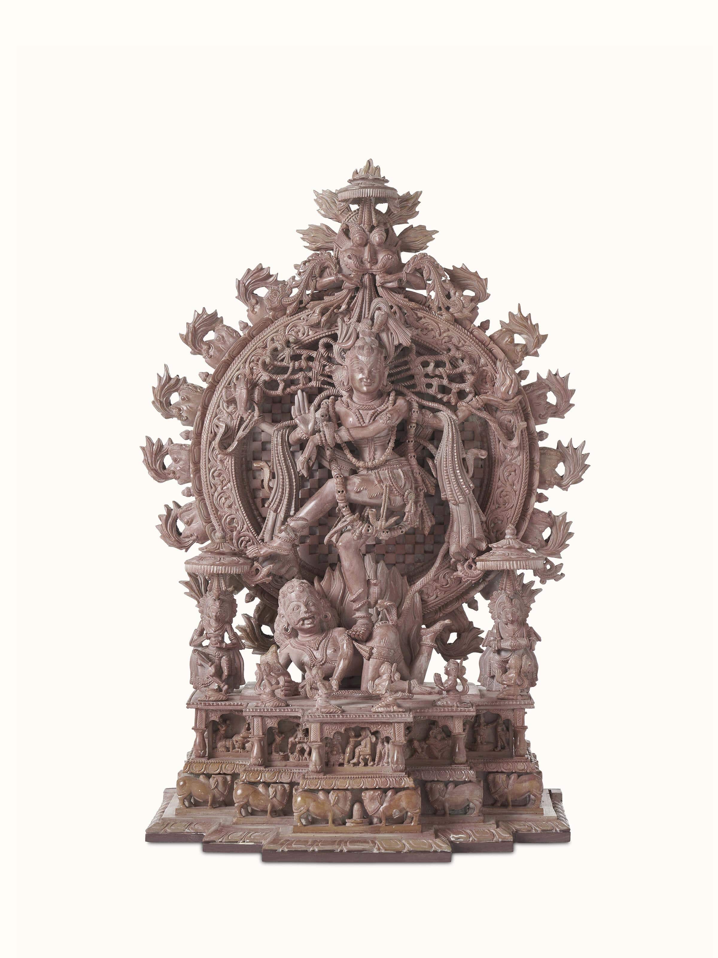 Carved stone dance of Natraj idol, showcasing the intricate details and dynamic pose of the deity.