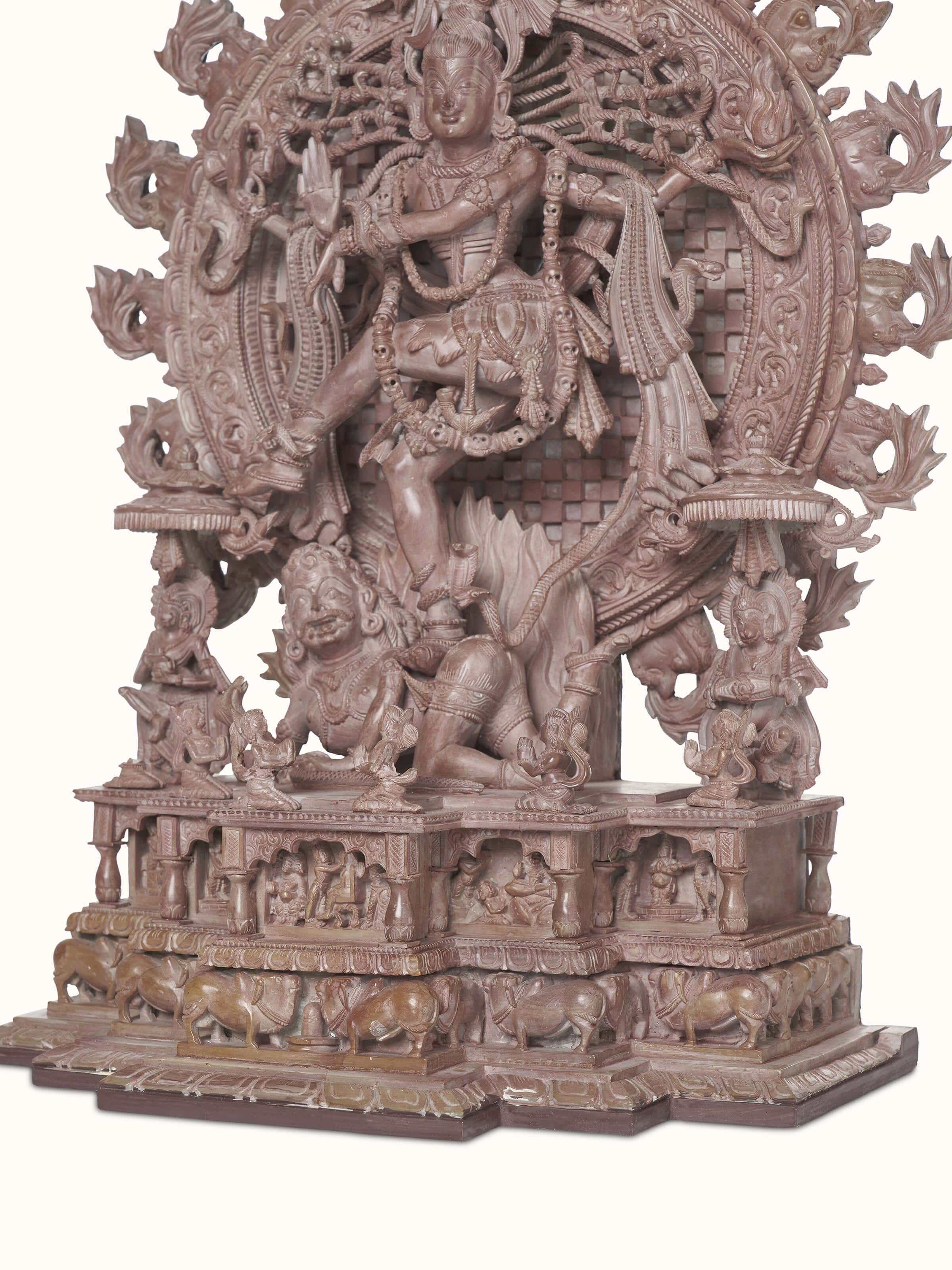 Full view of the carved stone Natraj idol, showcasing the artistic details and overall design.