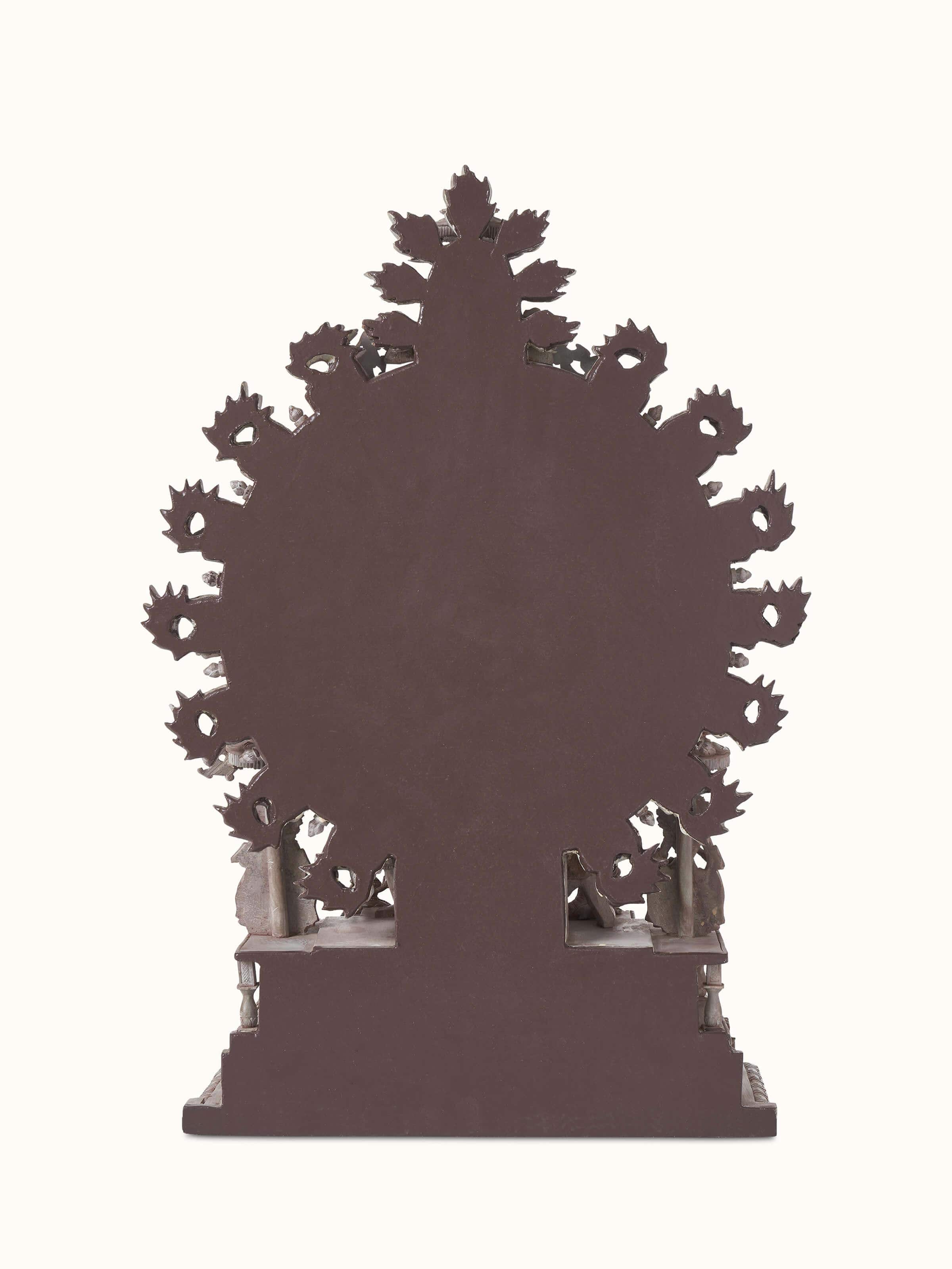 Side view of the carved stone Natraj idol, emphasizing the dynamic pose and artistic expression.