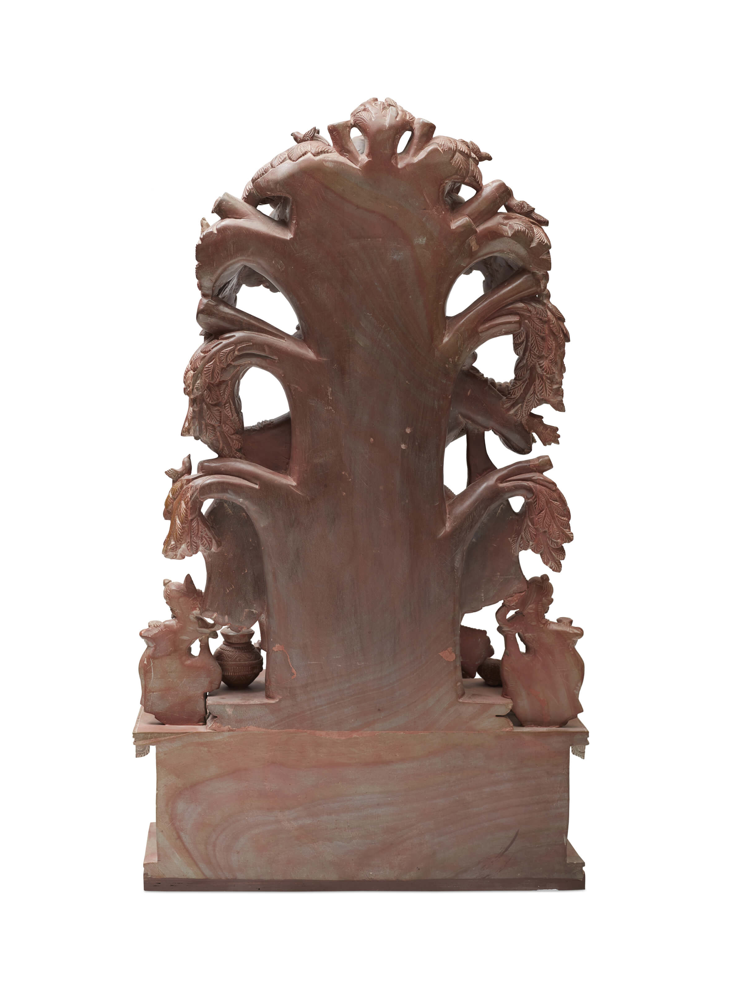 Back view of the Radha & Krishna carved stone idol under the tree.