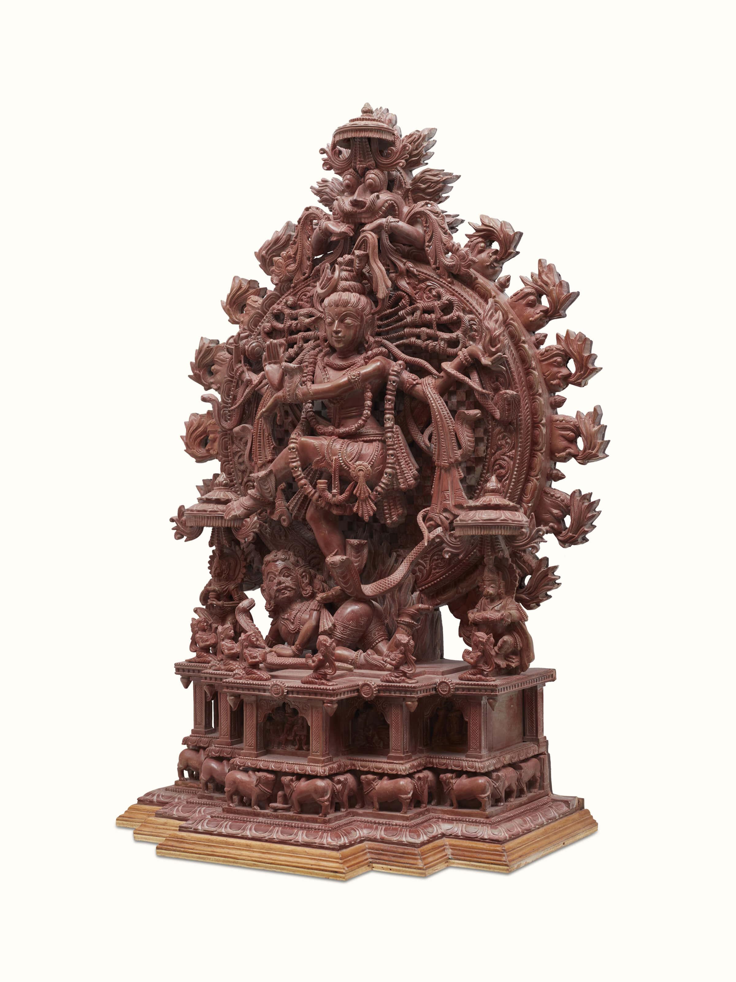 Side view of Carved stone Natraj idol in tandav dance pose, emphasizing intricate carvings and dynamic pose.