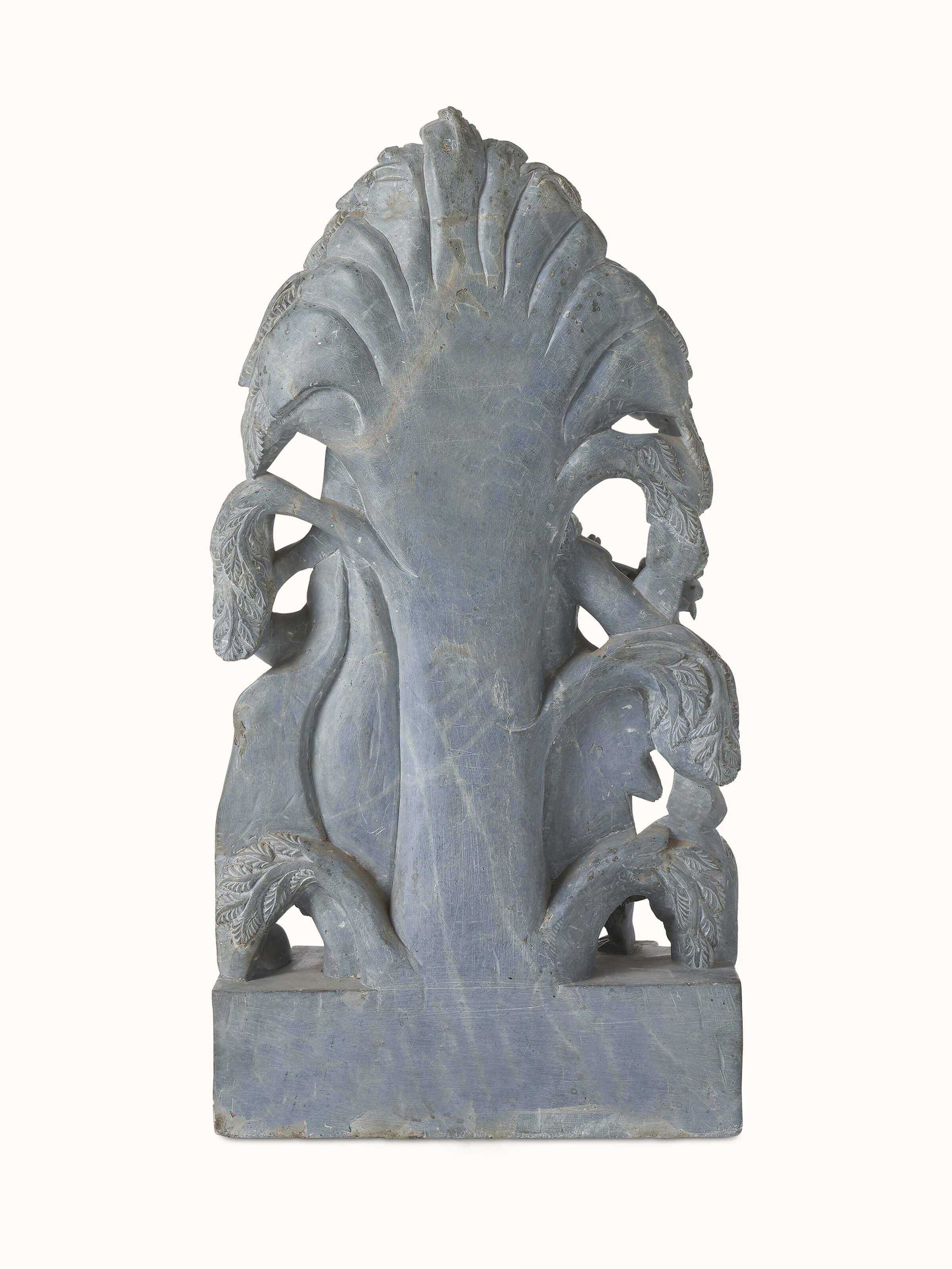 Artistic view of carved stone Radha & Krishna in love idol capturing the elegant form and intricate details of the figures.