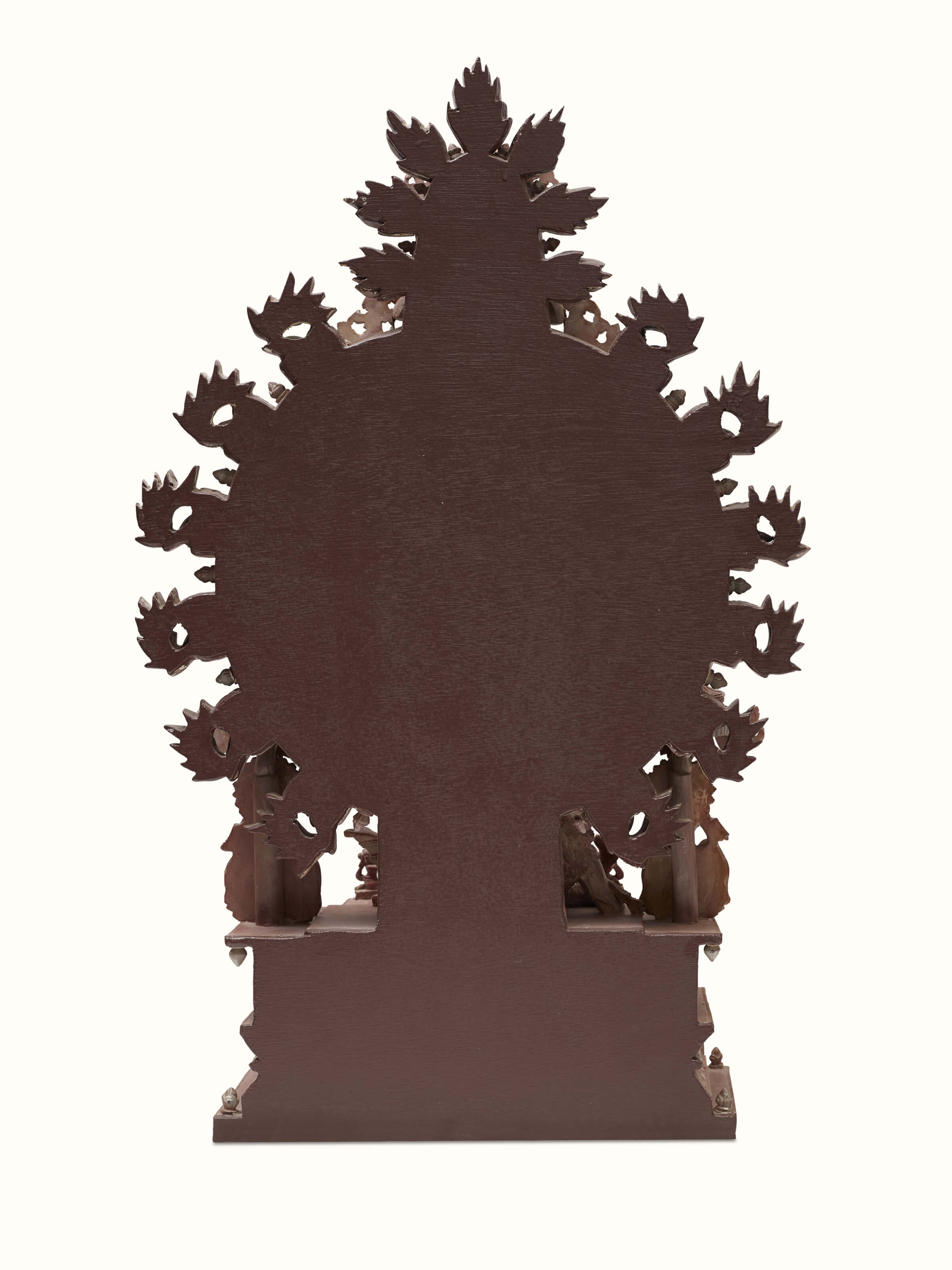 Angled view of Carved Stone Subduing Muyalaka Demon Idol, demonstrating the three-dimensional aspect and carving depth