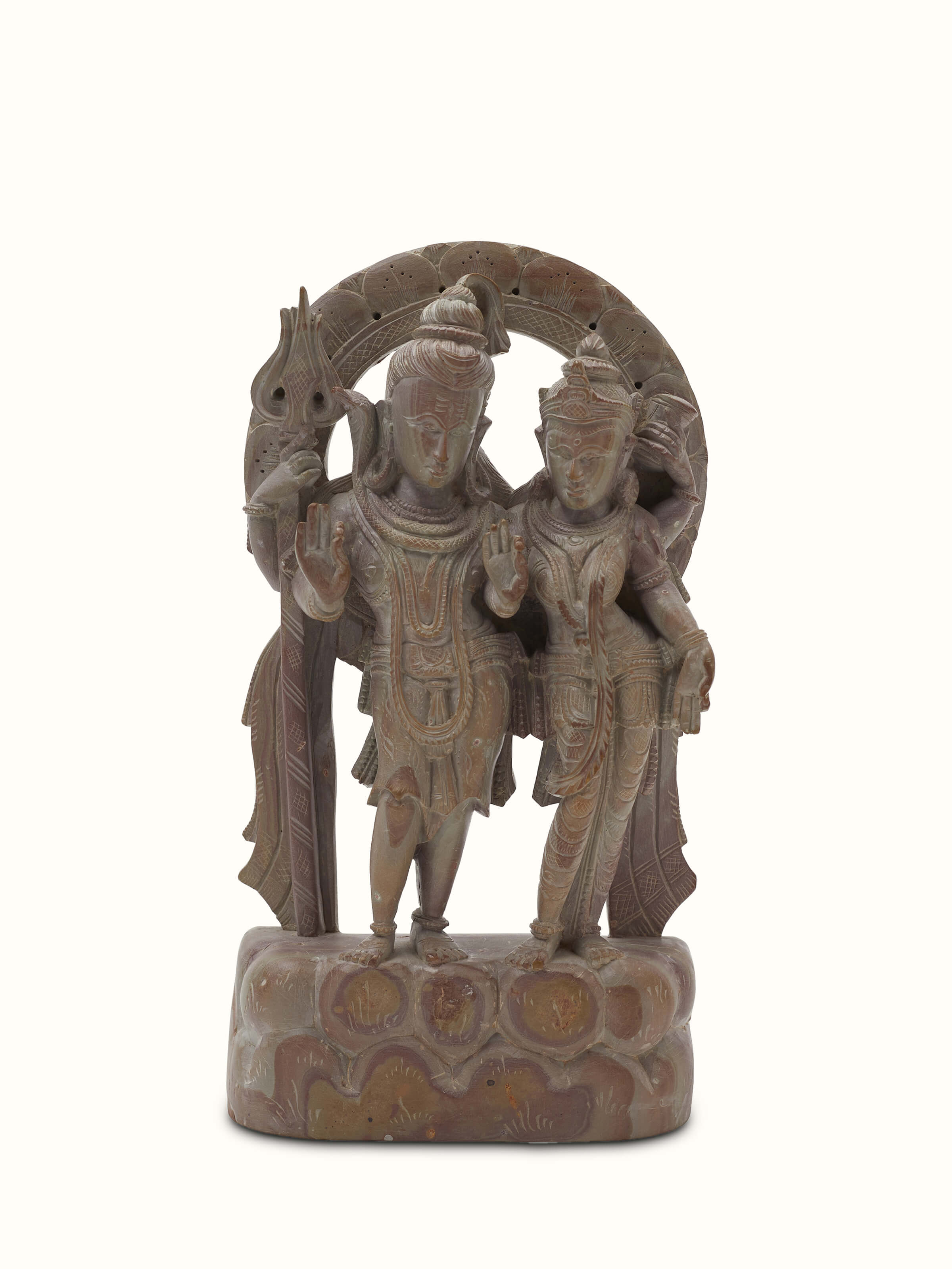 Carved stone Shiva & Parvati idol, showcasing intricate details and traditional stone craftsmanship.