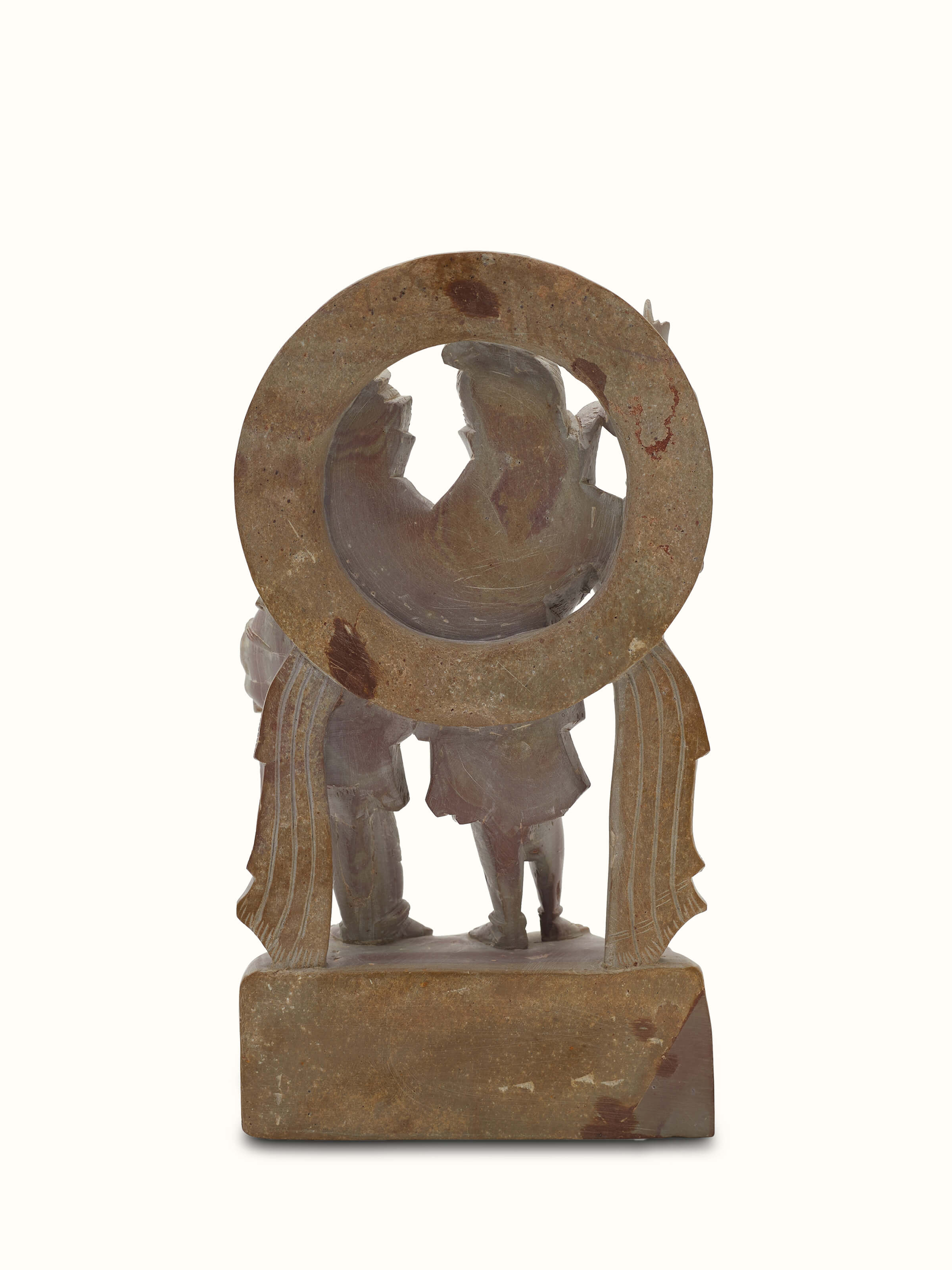 Detailed view of carved stone Shiva & Parvati idol, emphasizing the traditional and artistic stonework.