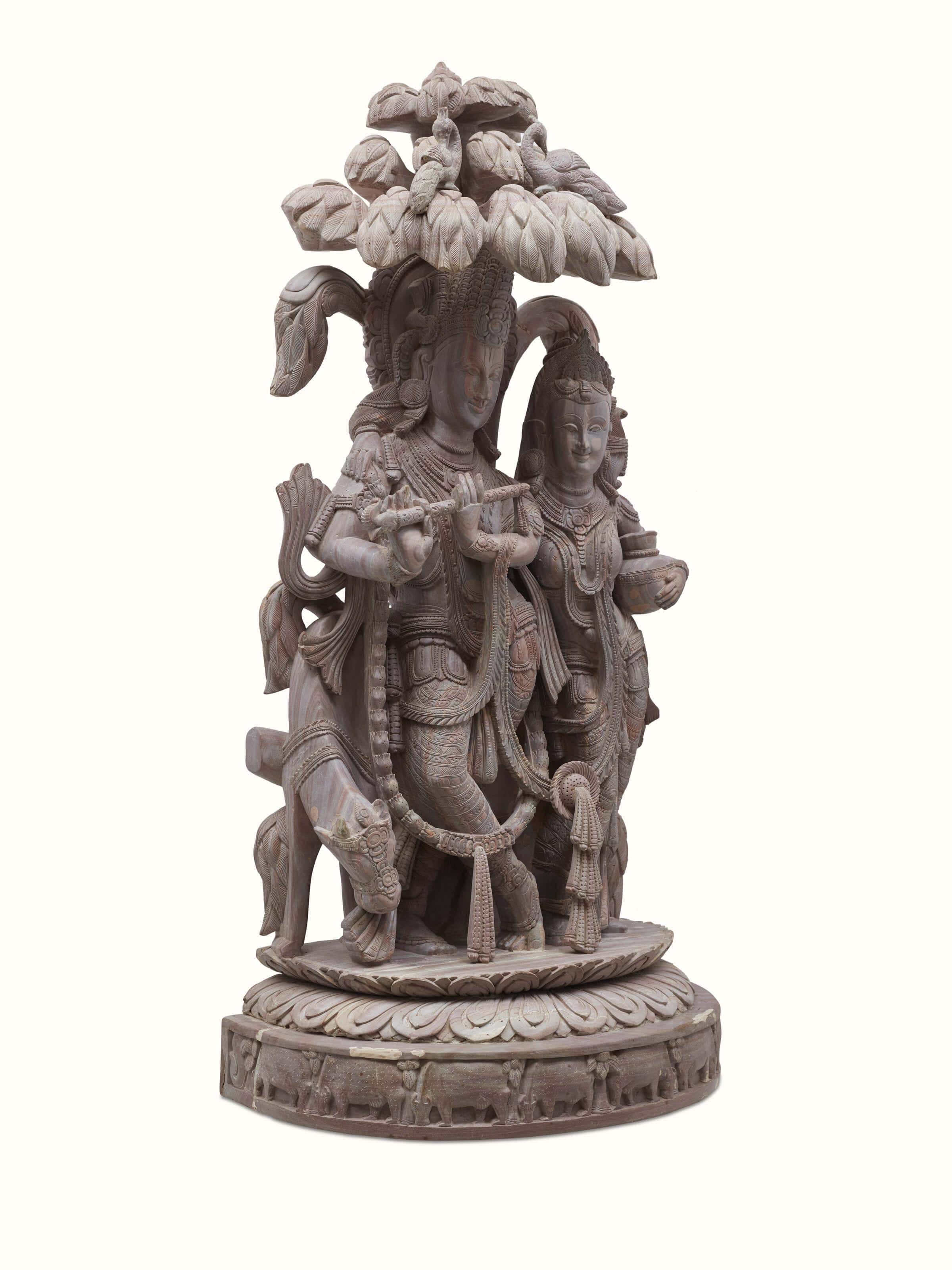 Angled view of Carved Stone Radha & Krishna's Romance Idol highlighting artistry