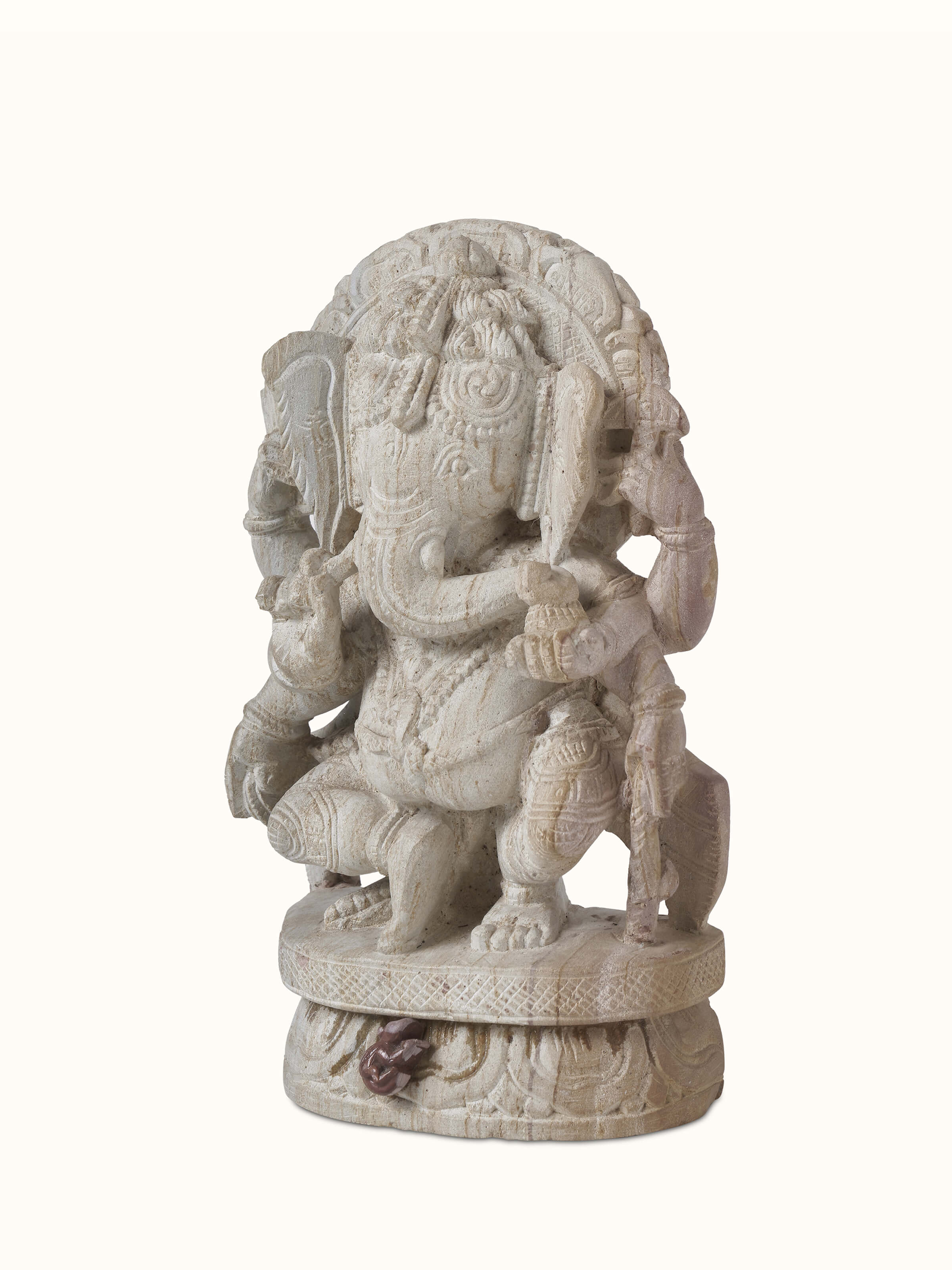 Close-up of Divine Carved Stone Ganapathi Idol highlighting the fine carvings and religious symbolism