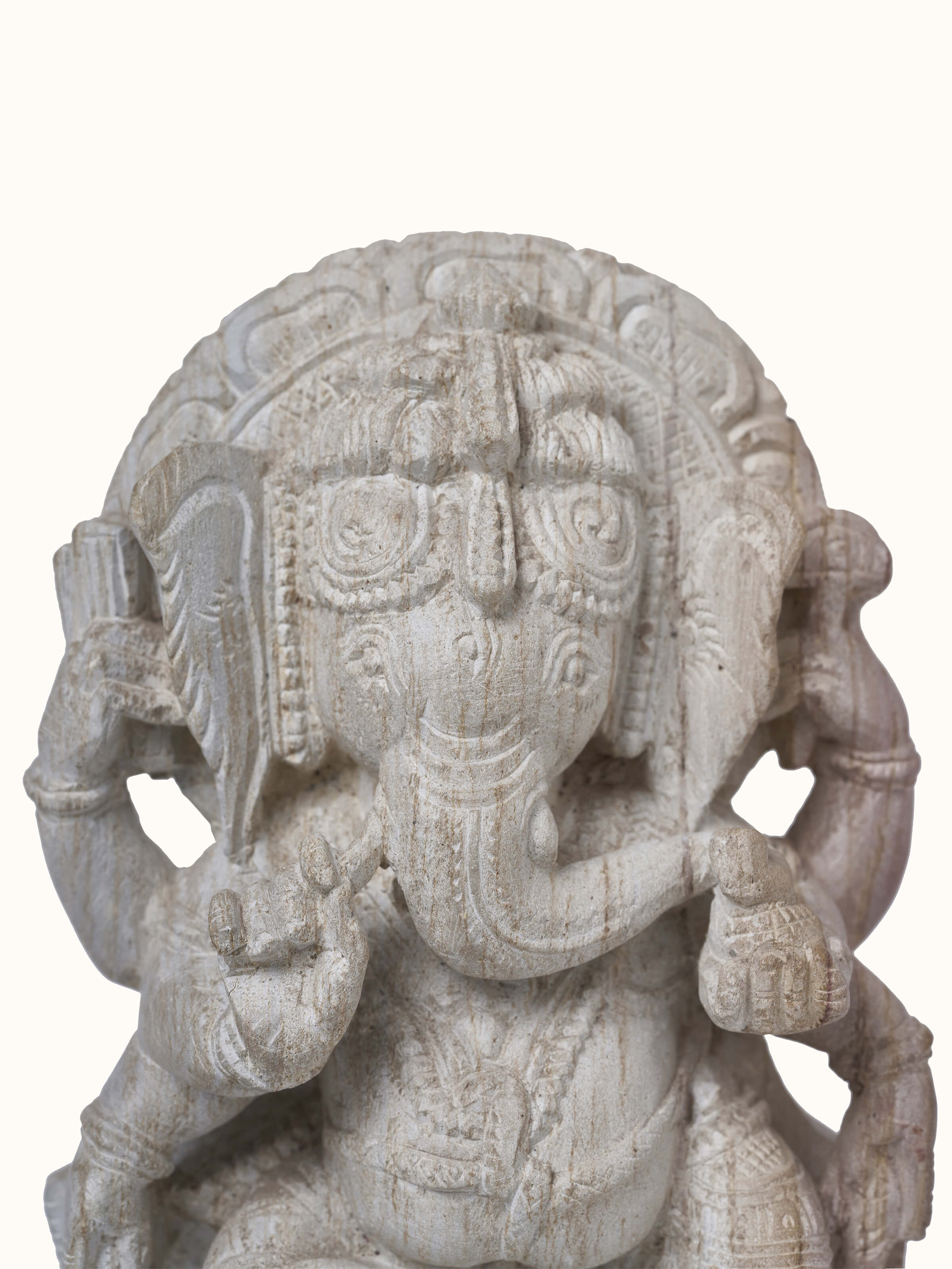 Angled view of Divine Carved Stone Ganapathi Idol emphasizing the elegance of the stone carving