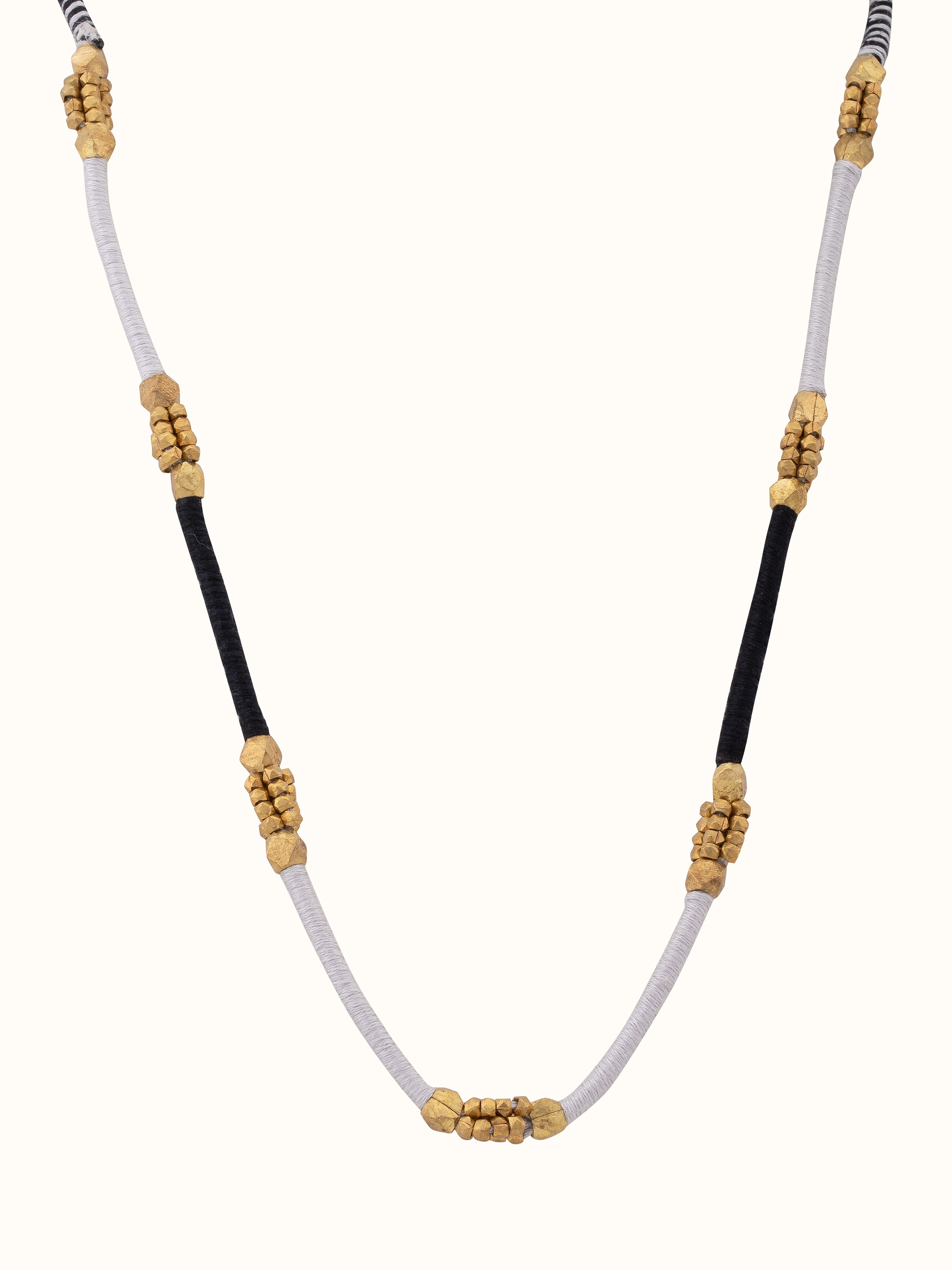 Front view of Dhokra Long Necklace featuring traditional Dhokra metalwork with intricate patterns and a long, elegant design.