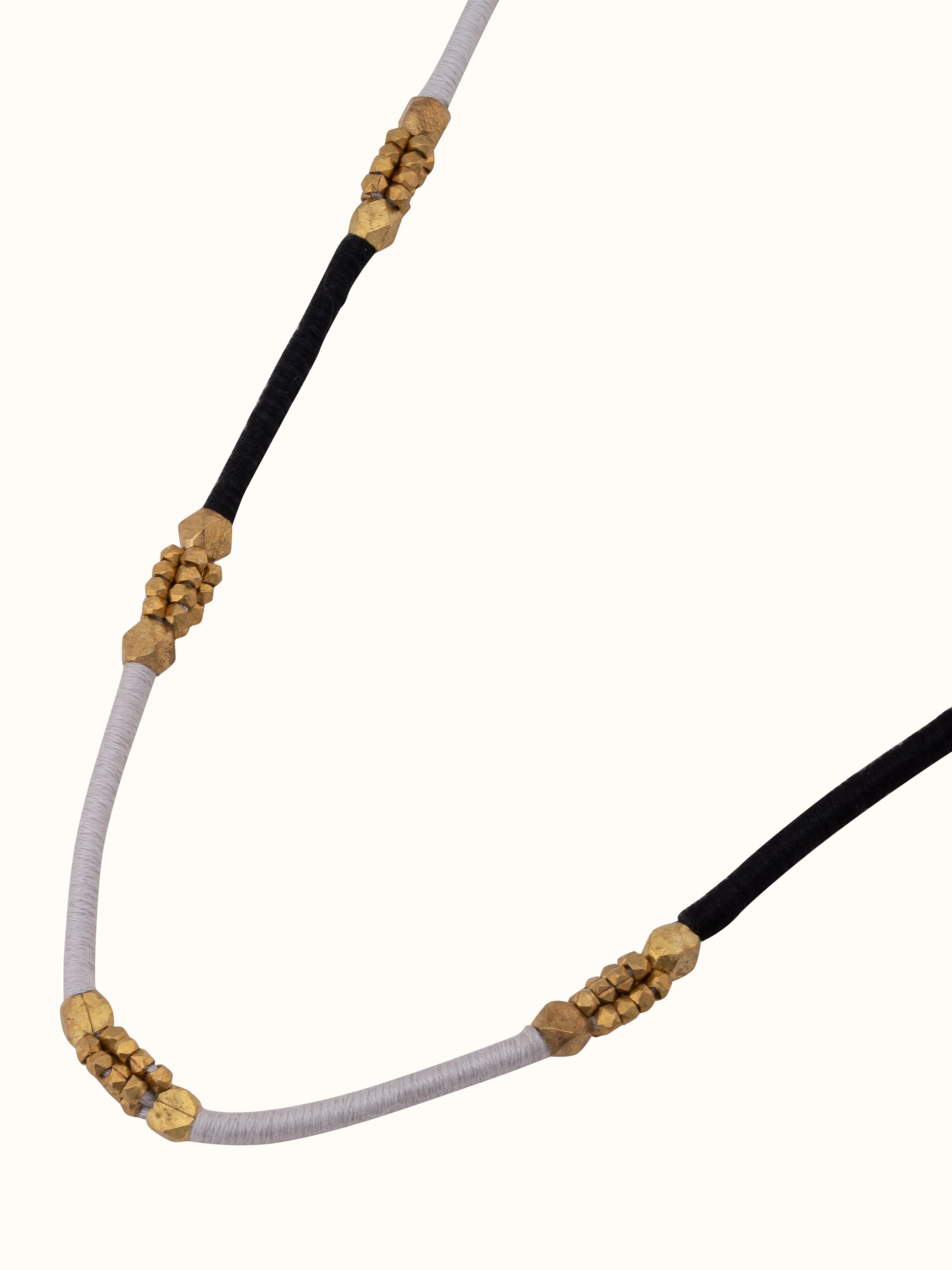 Back view of Dhokra Long Necklace showing the secure clasp and smooth finish of the necklace.