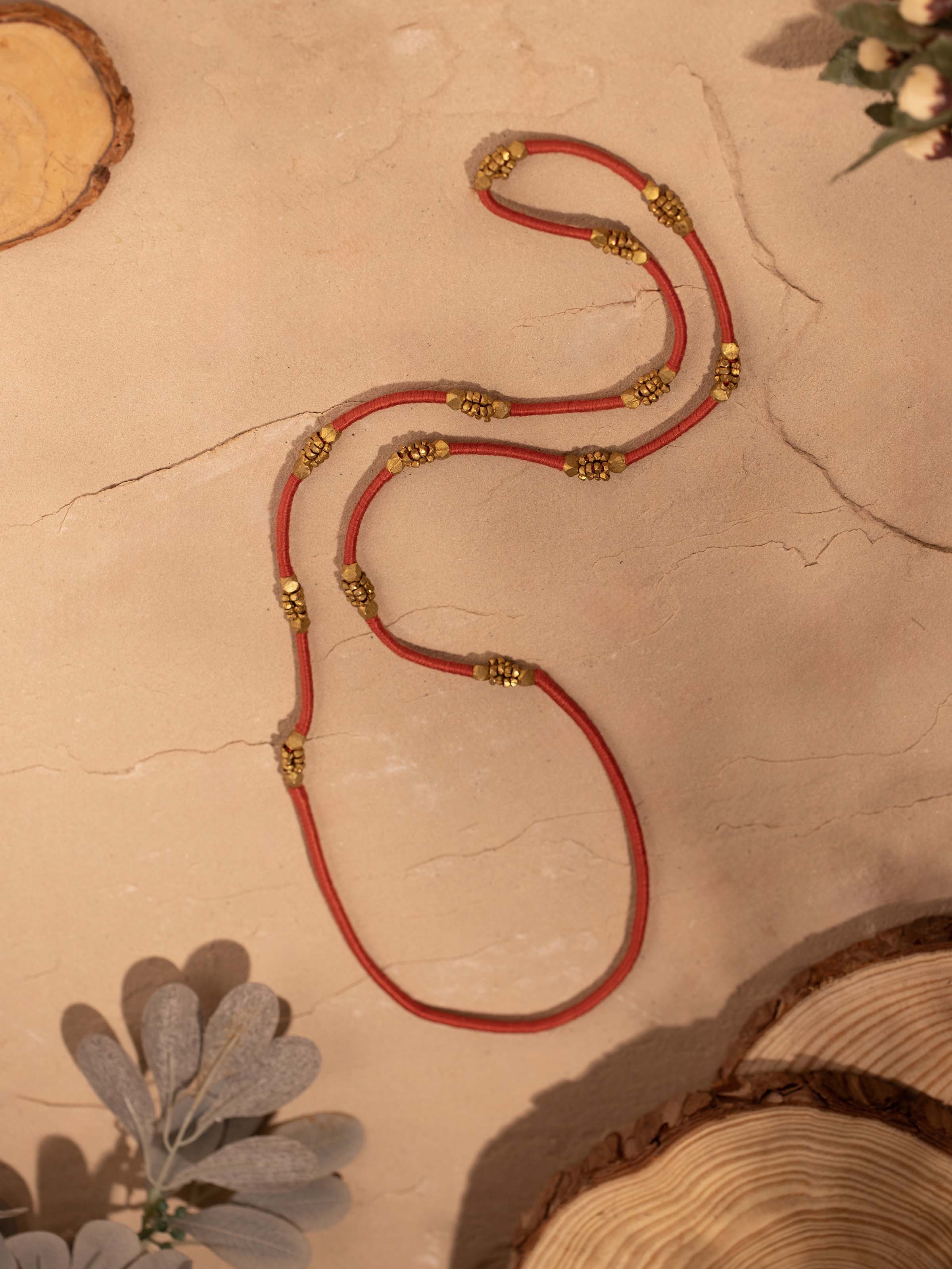 Side view of Dhokra long necklace showcasing intricate tribal patterns and detailed craftsmanship