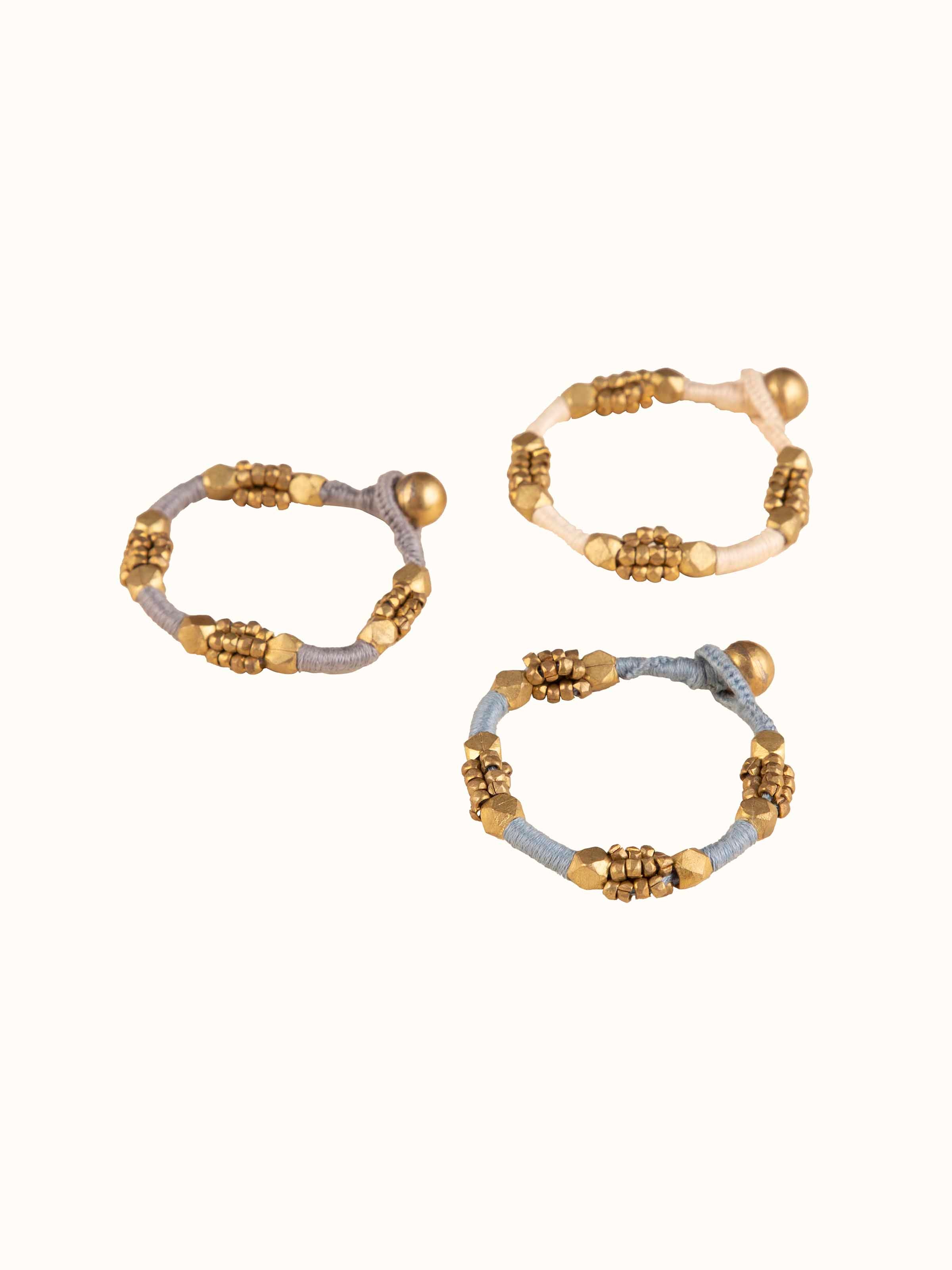 Detailed view of Dhokra bracelet set with focus on traditional metal crafting.