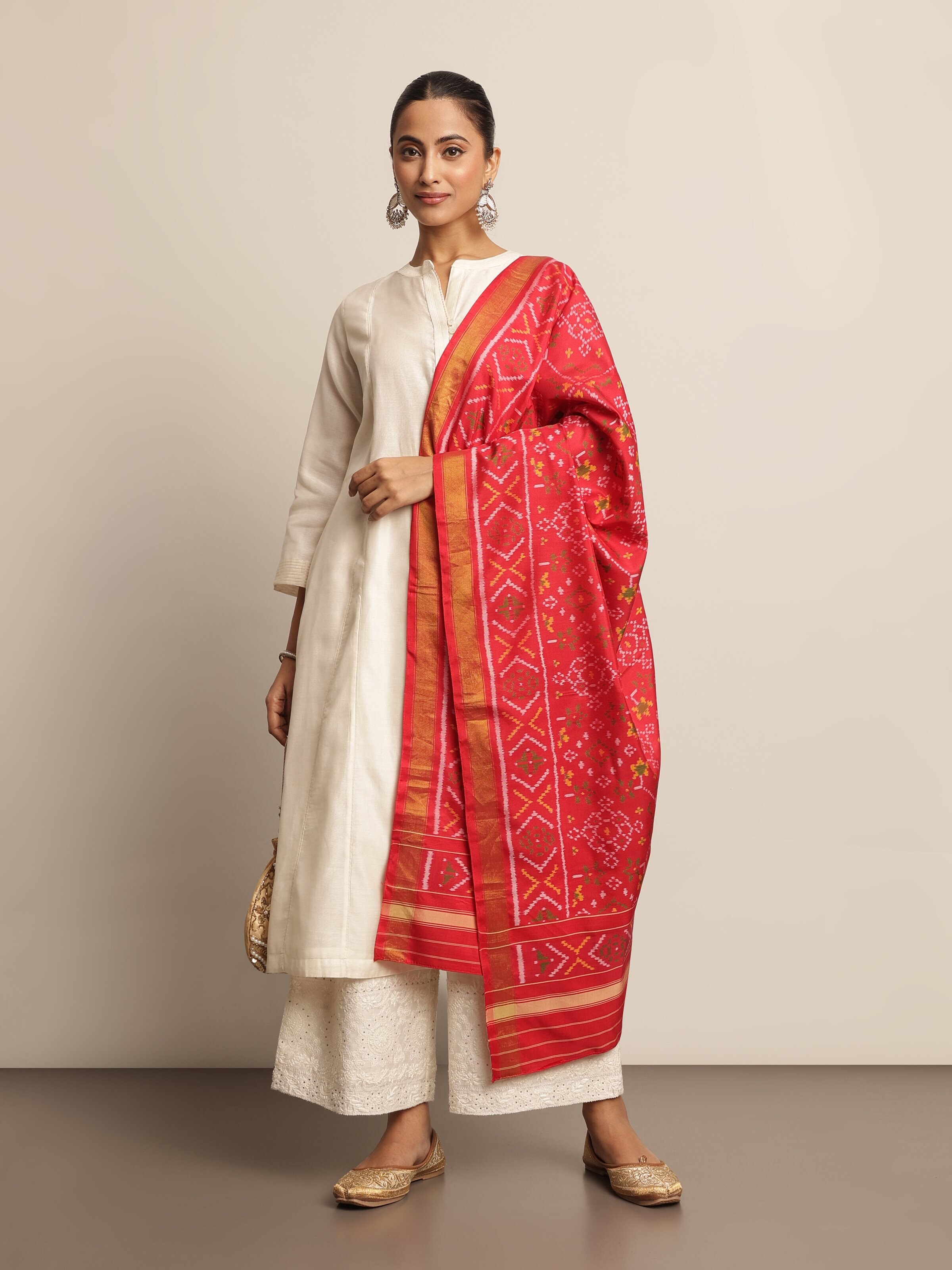 Lifestyle view of red Ikat dupatta draped over a kurta, adding a vibrant accent to ethnic wear