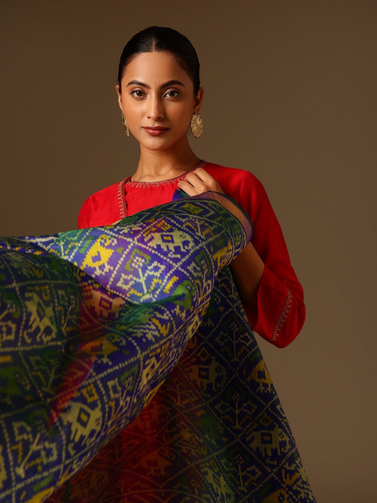 Angled view of Blue Silk Ikat Dupatta highlighting vibrant blue color and detailed weaving.