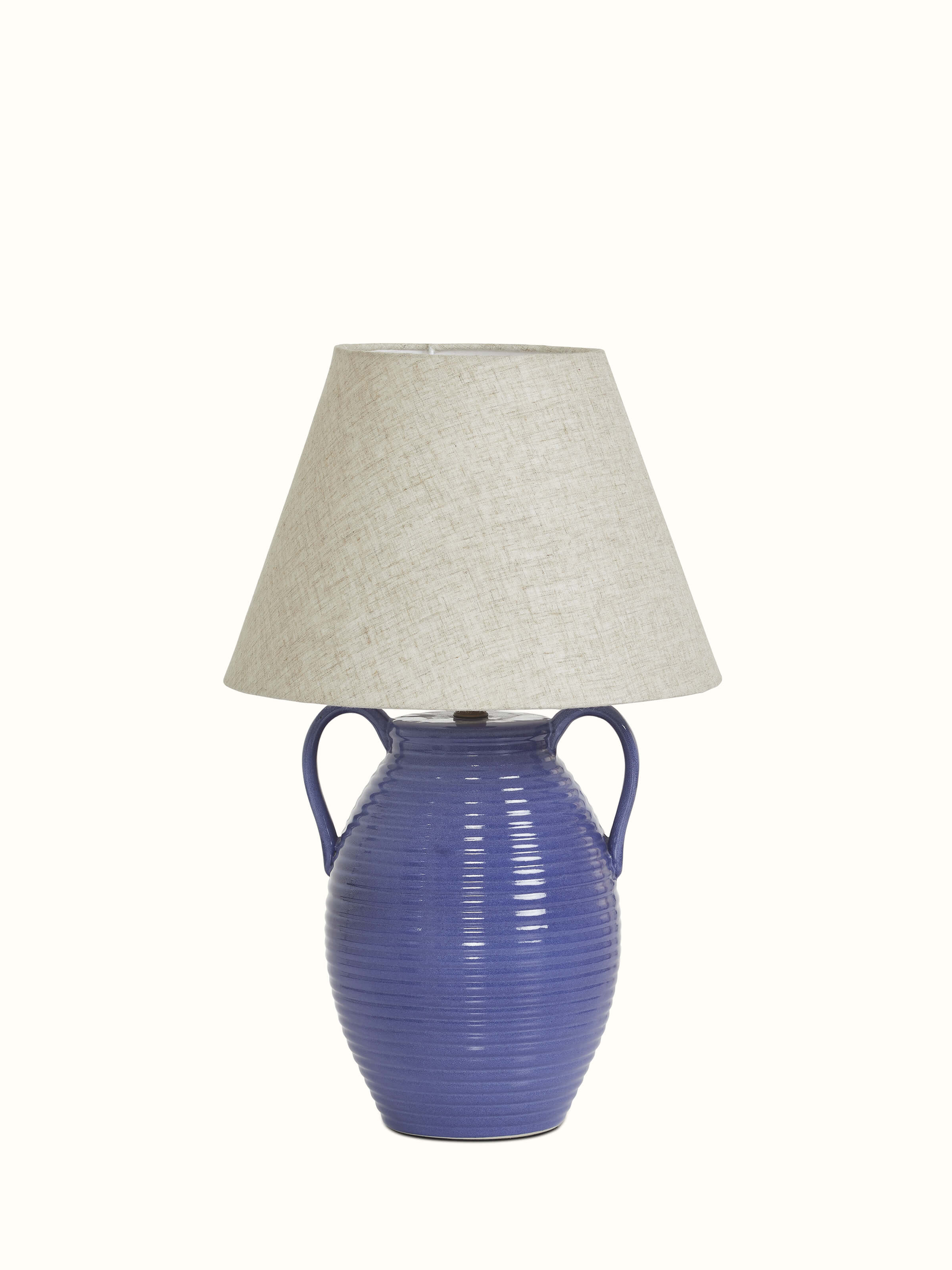 Studio pottery & cotton table lamp in off-white color, showing its elegant design and soft, neutral hue.