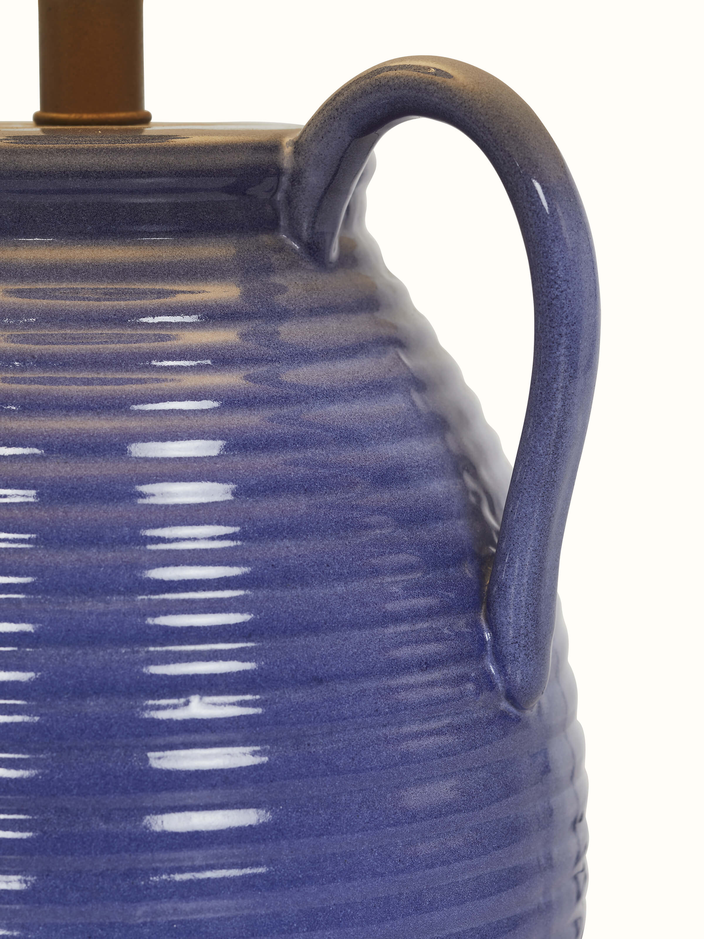 Detailed view of the off-white studio pottery & cotton table lamp, focusing on the fabric texture and lamp base.