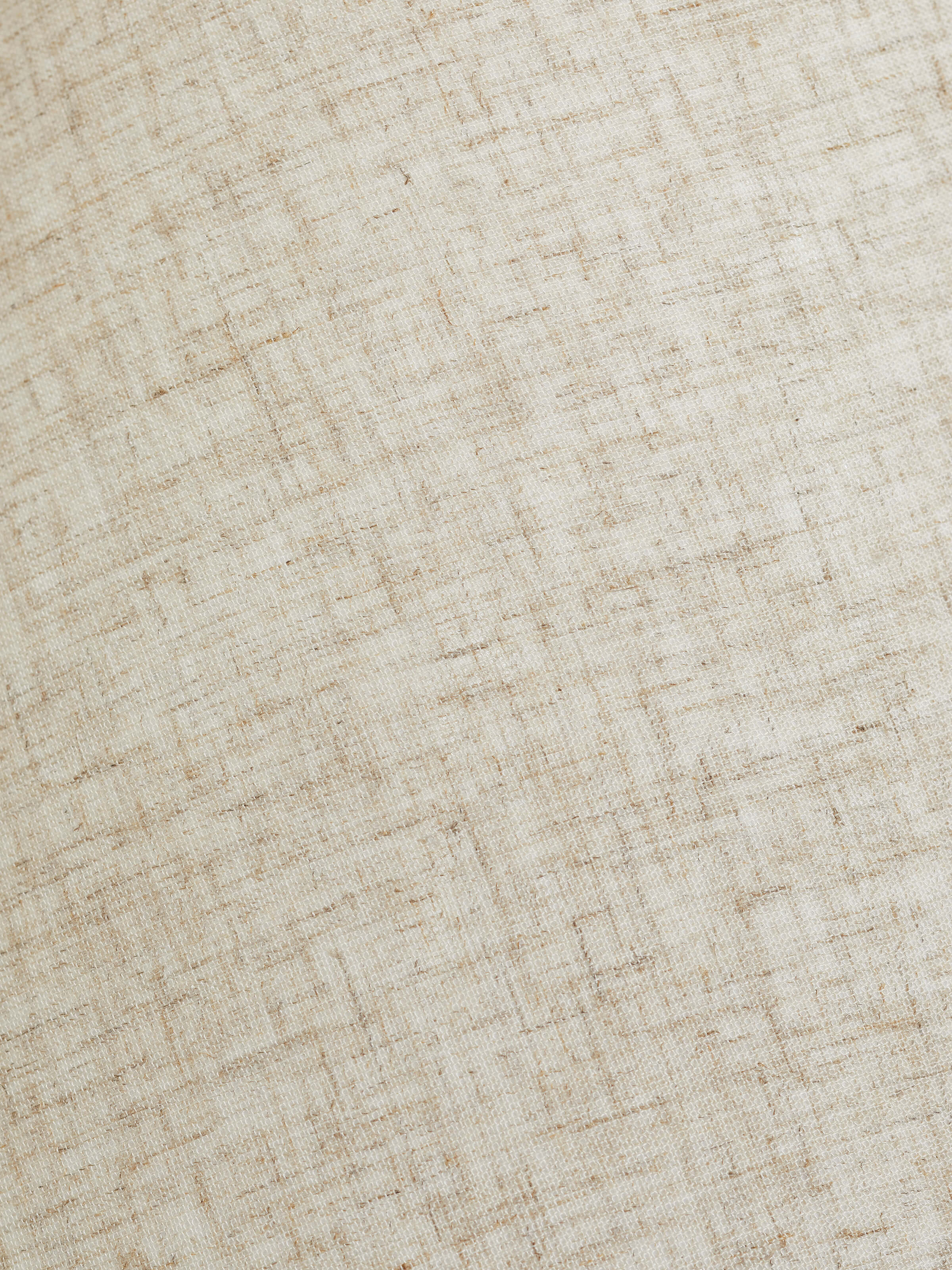 Top view of the off-white studio pottery & cotton table lamp, showing the lamp shade and light fixture.