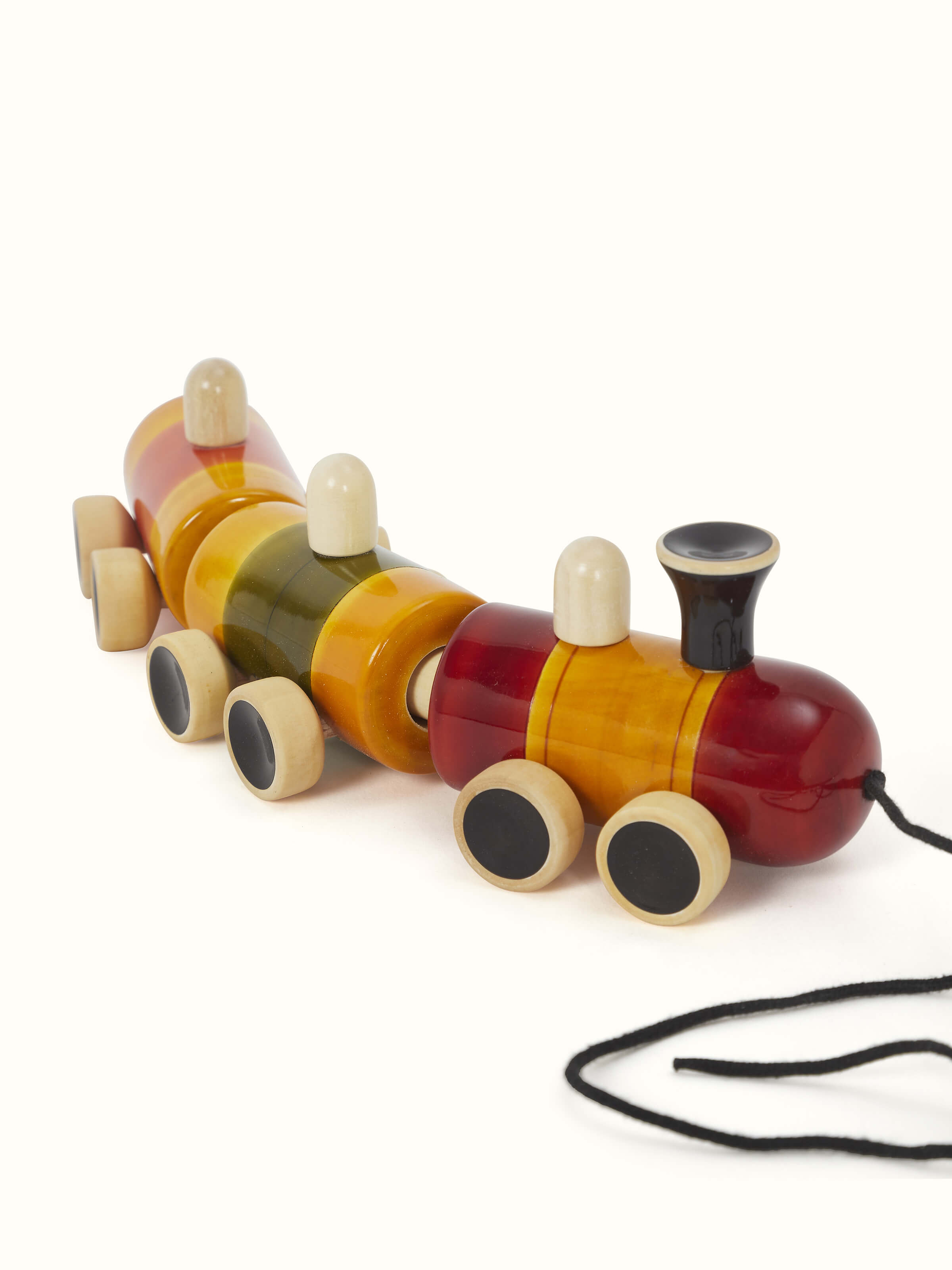 Front view of Channapatna White Wood Pom Pom Rail Toy showcasing colorful pom-poms and fine craftsmanship