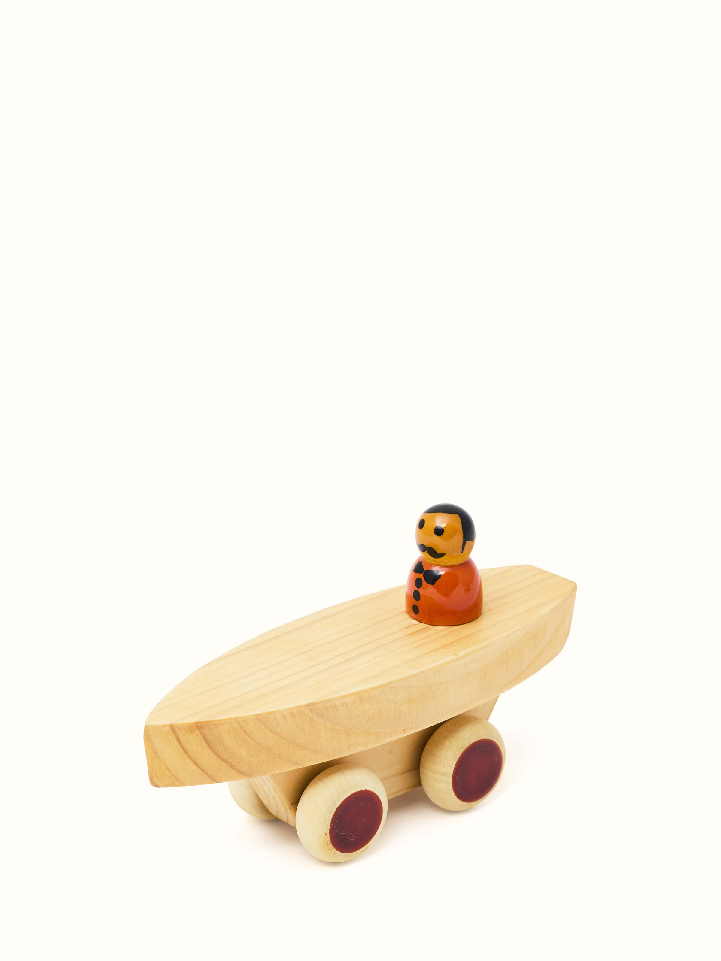 Close-up view of Channapatna White Wood Vehicle Set by Swadesh showcasing the fine detailing and smooth finish of the wooden toys.