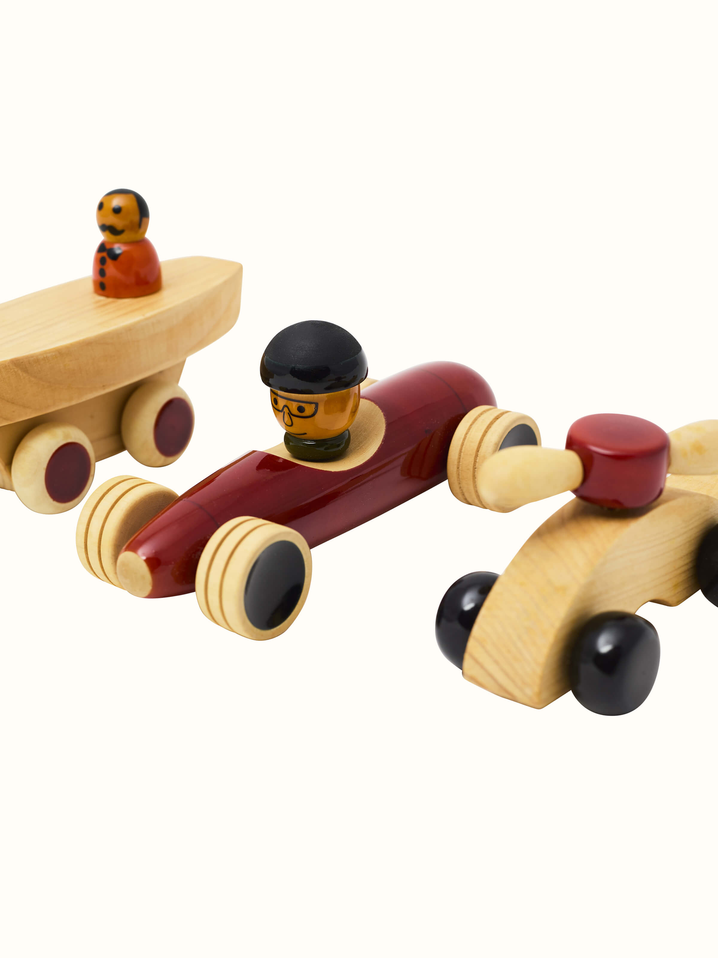 Top view of Channapatna White Wood Vehicle Set by Swadesh displaying the colorful vehicles arranged neatly in the set.