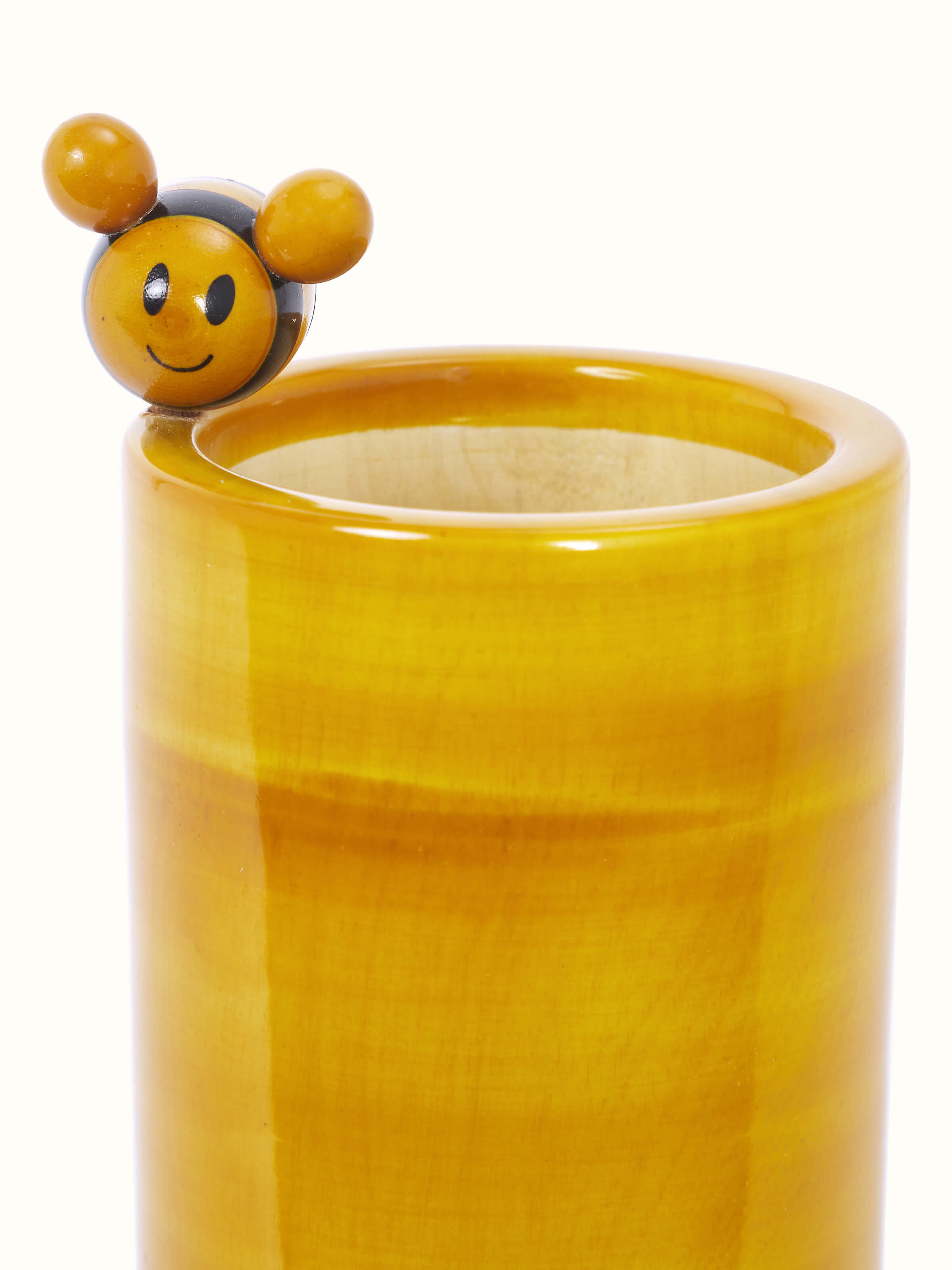 Close-up view of Channapatna Wooden Honey Bee Pencil Holder by Swadesh focusing on the artistic honey bee design and natural wood texture.