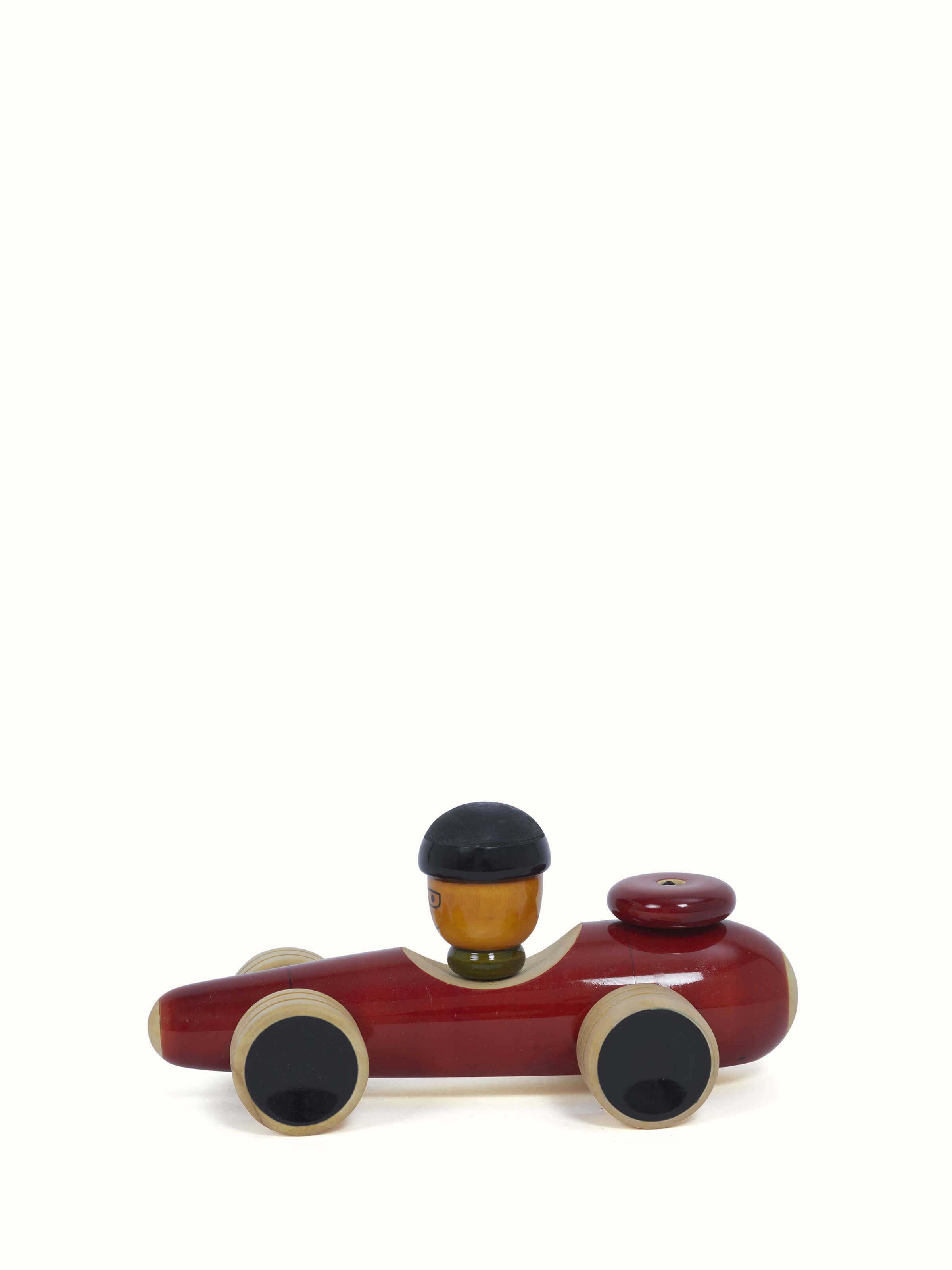 Angled view of Channapatna Wooden Vehicle Toy showing its sturdy design and bright color combination