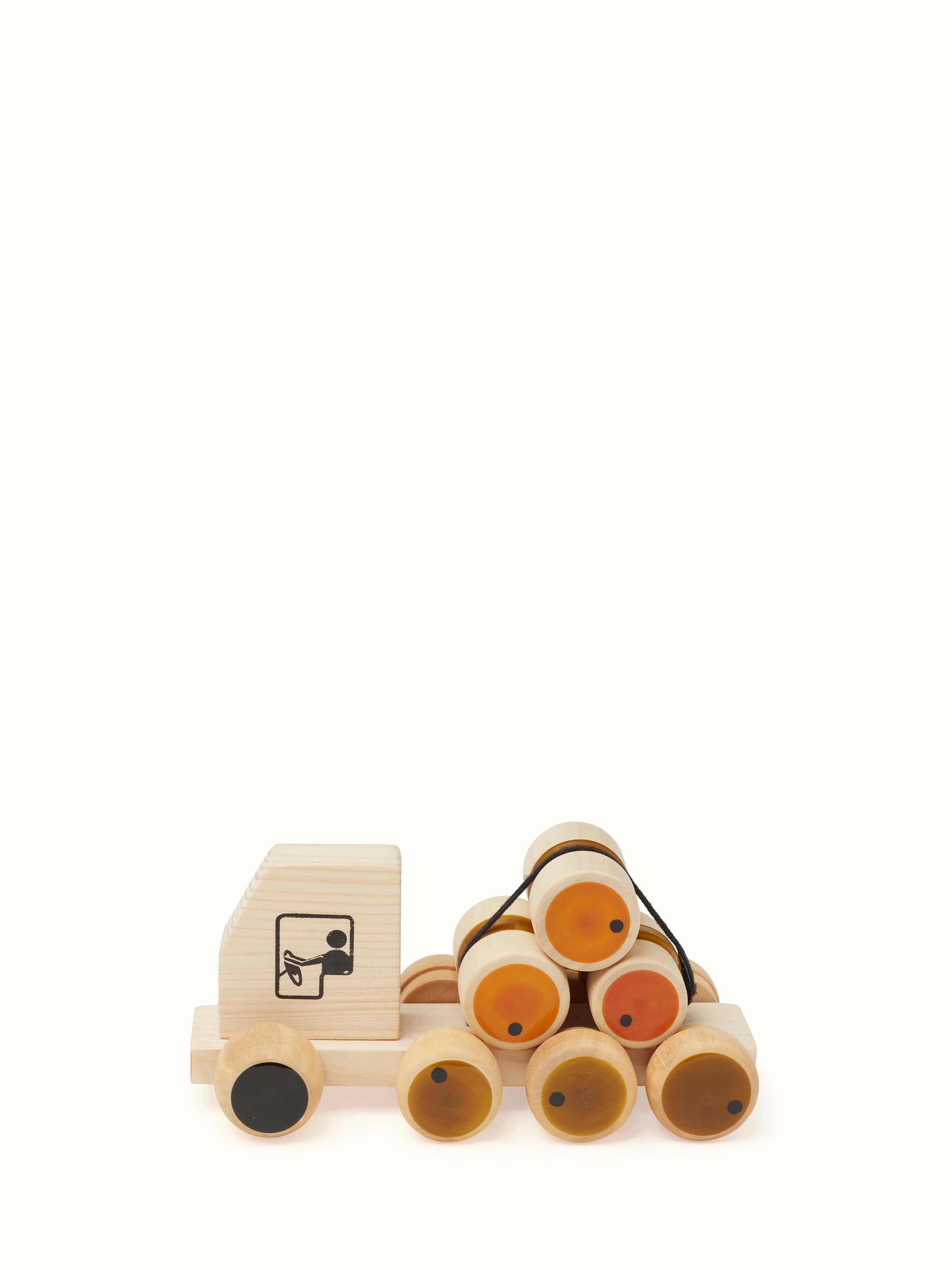 Angled view of Channapatna Wooden Rumbelorry Toy revealing dynamic shape and traditional artistry.