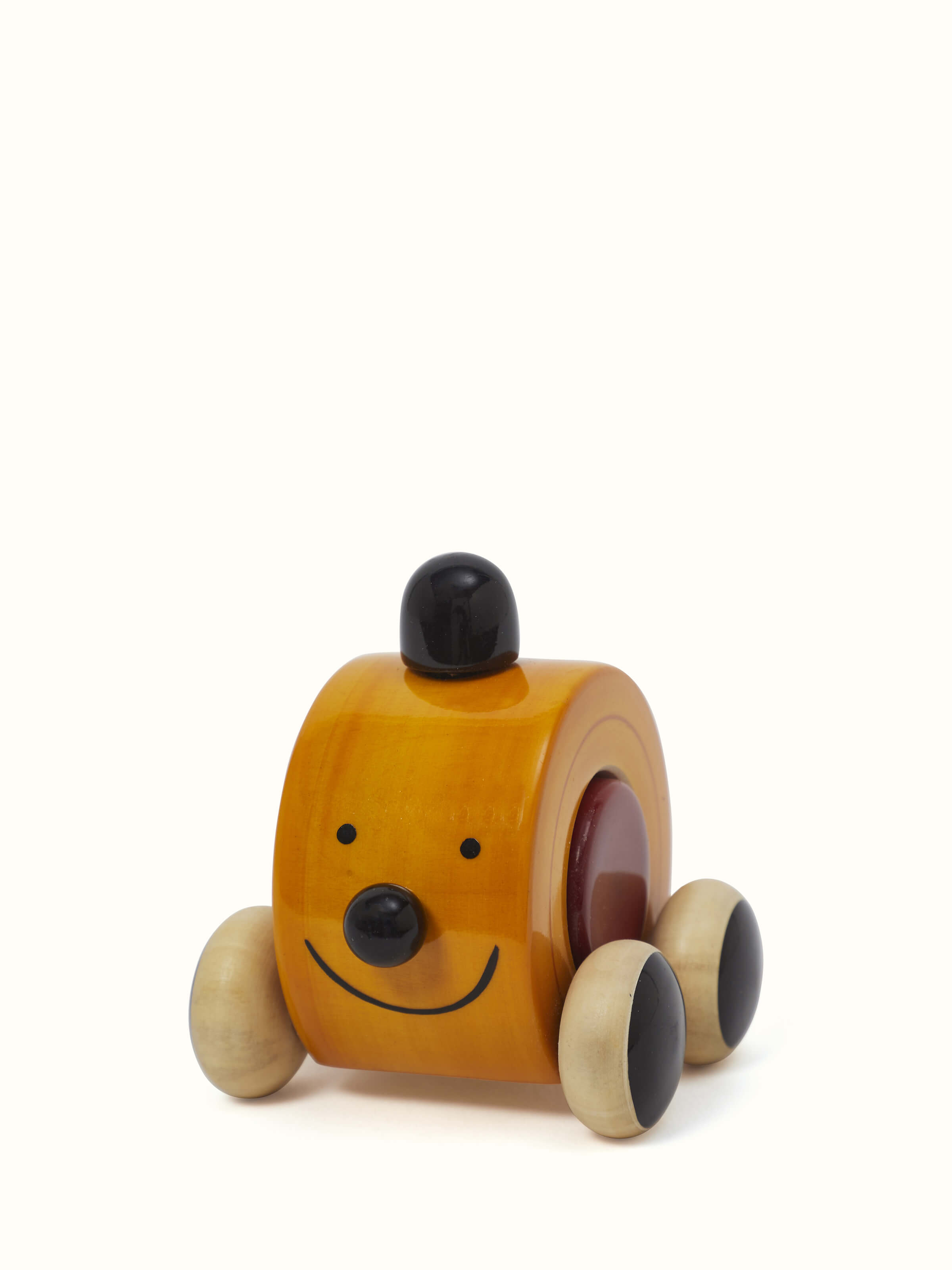 Side view of Channapatna Wooden Play Toy by Swadesh displaying its eco-friendly materials, intricate design, and appealing aesthetic for children.
