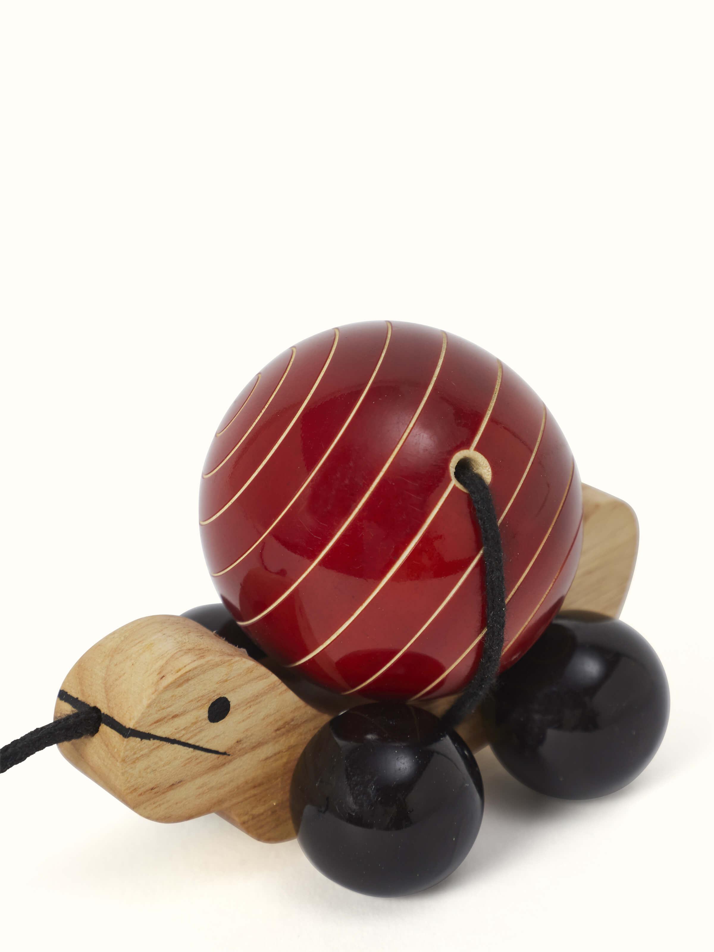 Close-up of Channapatna Wooden Pull-along Toy, emphasizing the craftsmanship and fun design