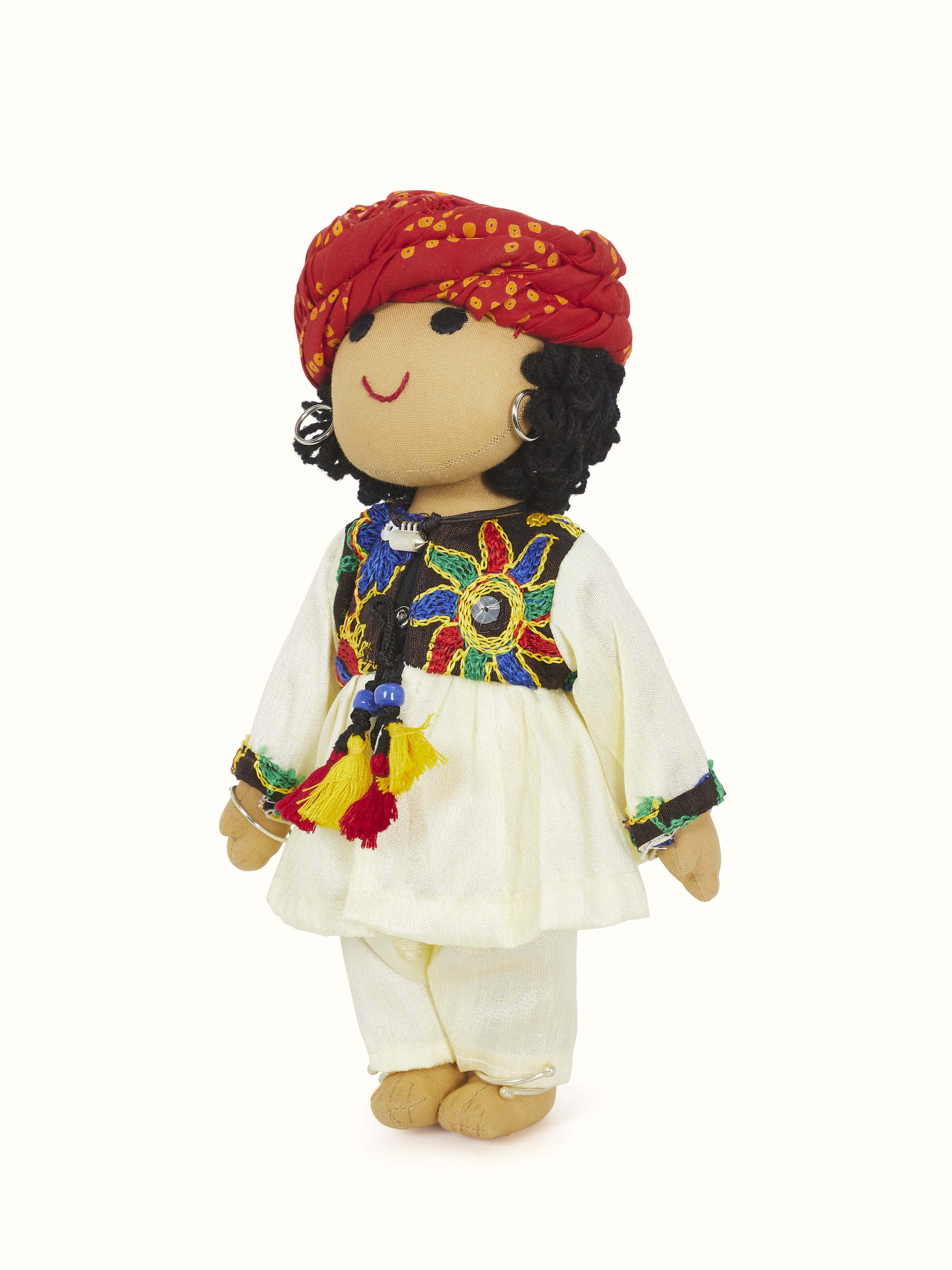 Angled view of Crocheted cotton Rajasthani boy soft toy highlighting the intricate crochet work and playful design
