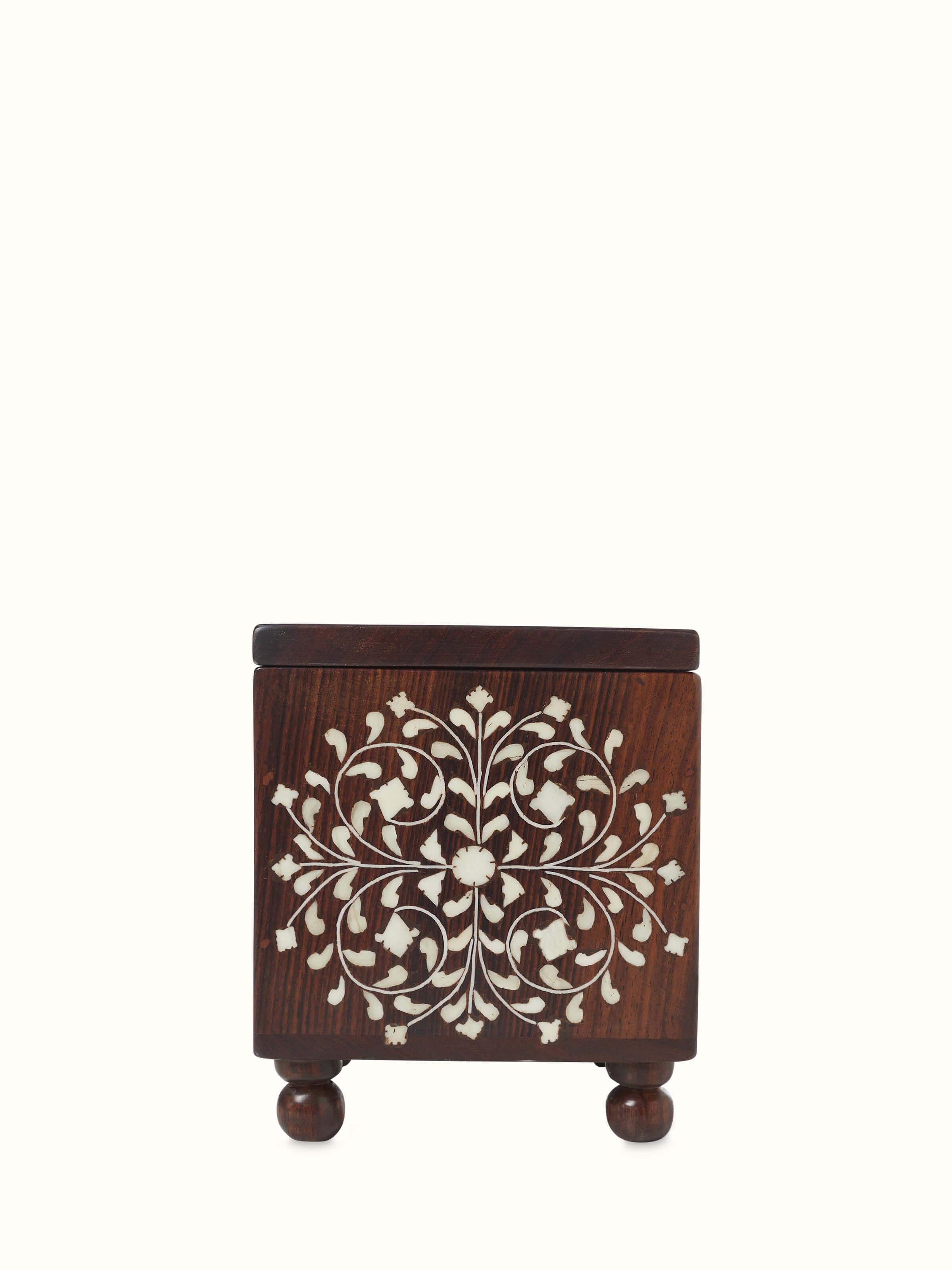 Sheesham wood and bone inlaid storage box with intricate designs and rich wood grain.