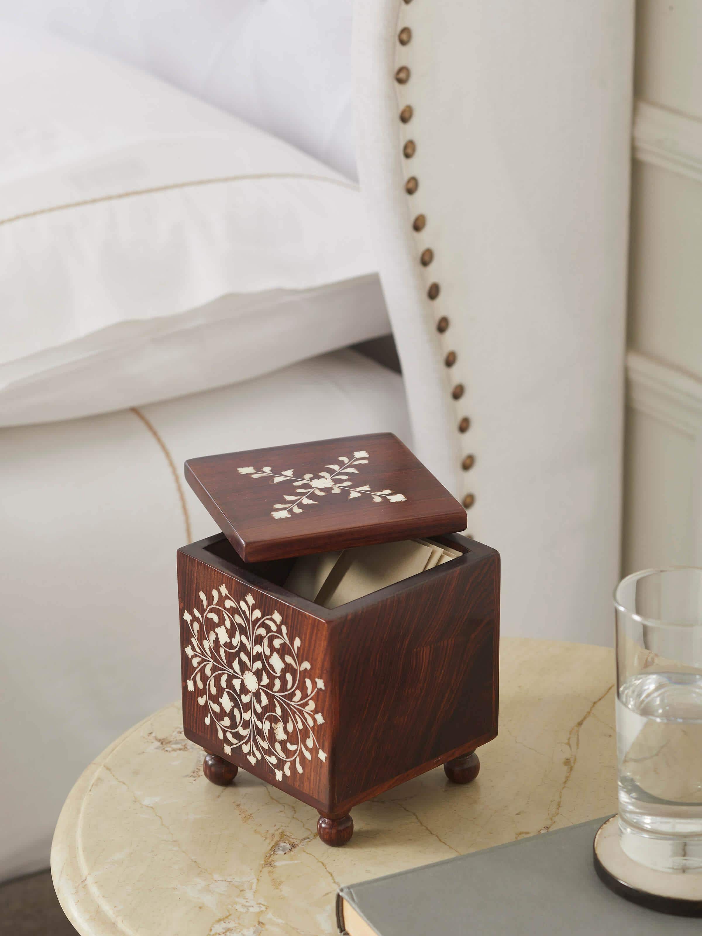 Close-up of Sheesham wood and bone inlaid storage box, showcasing detailed inlay work and polished surface.