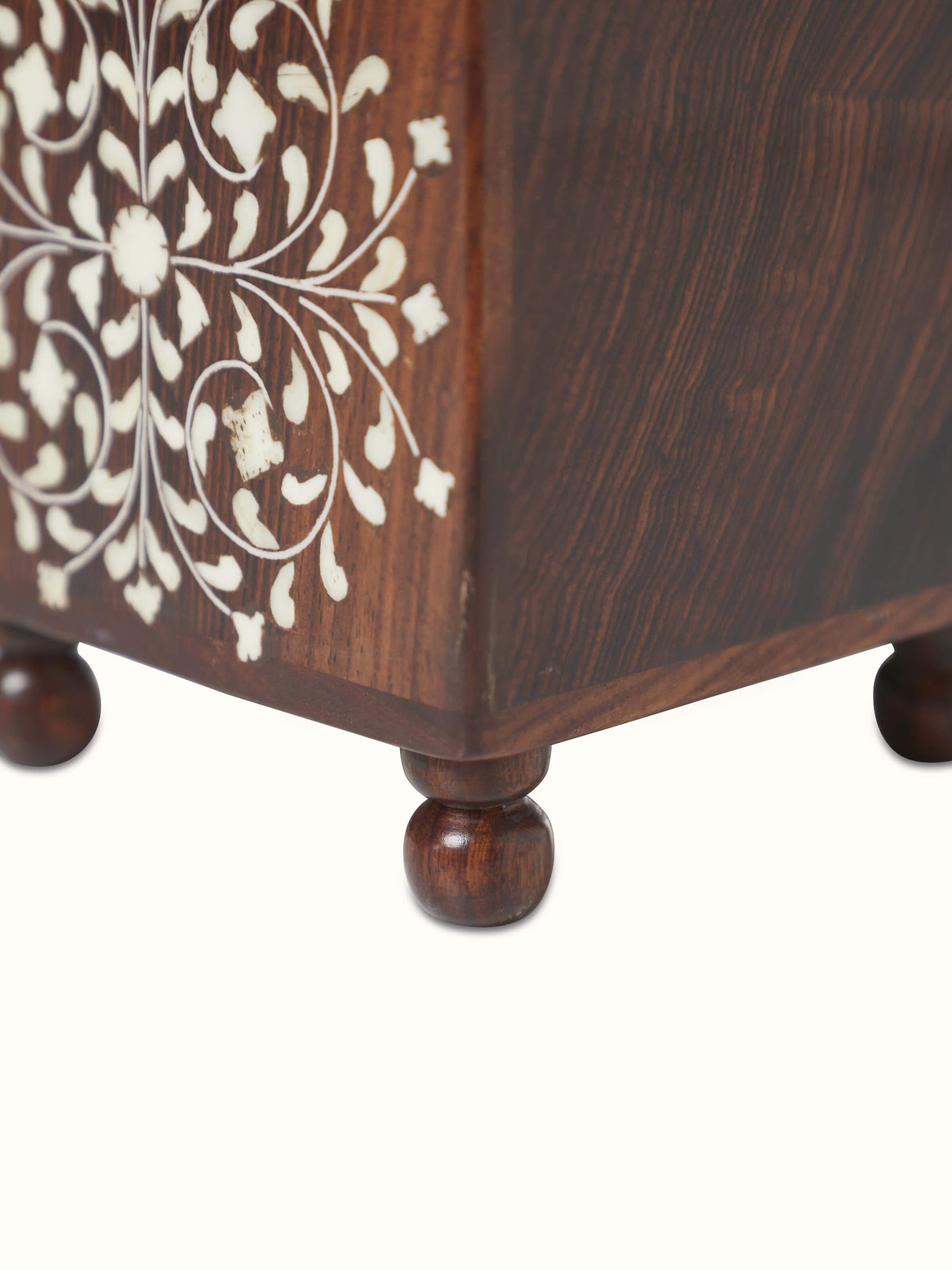 Angled view of Sheesham wood and bone inlaid storage box, focusing on its intricate detailing and durable design.