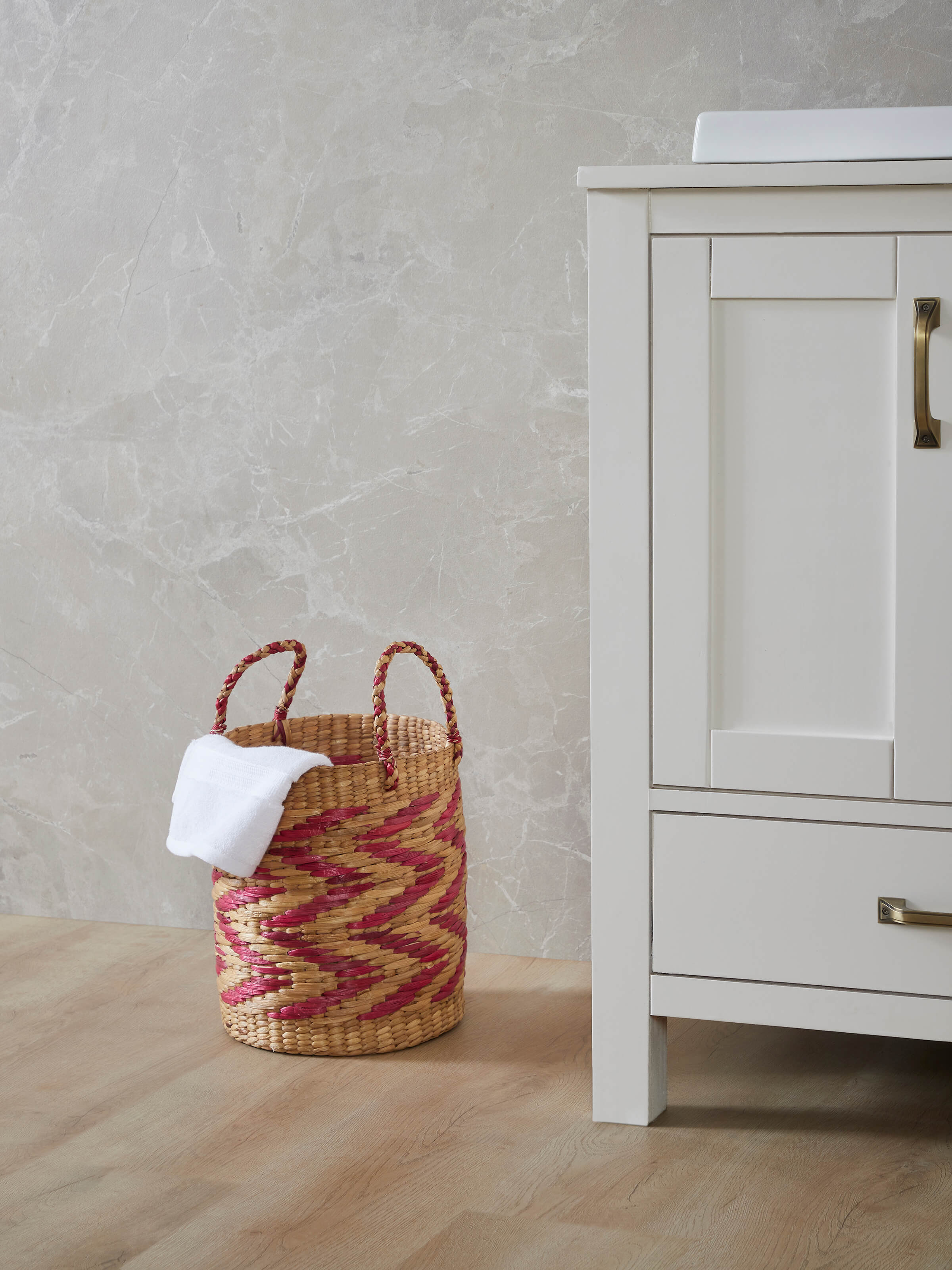 Side view of natural water hyacinth fibre waste bin multicolor highlighting the weave pattern