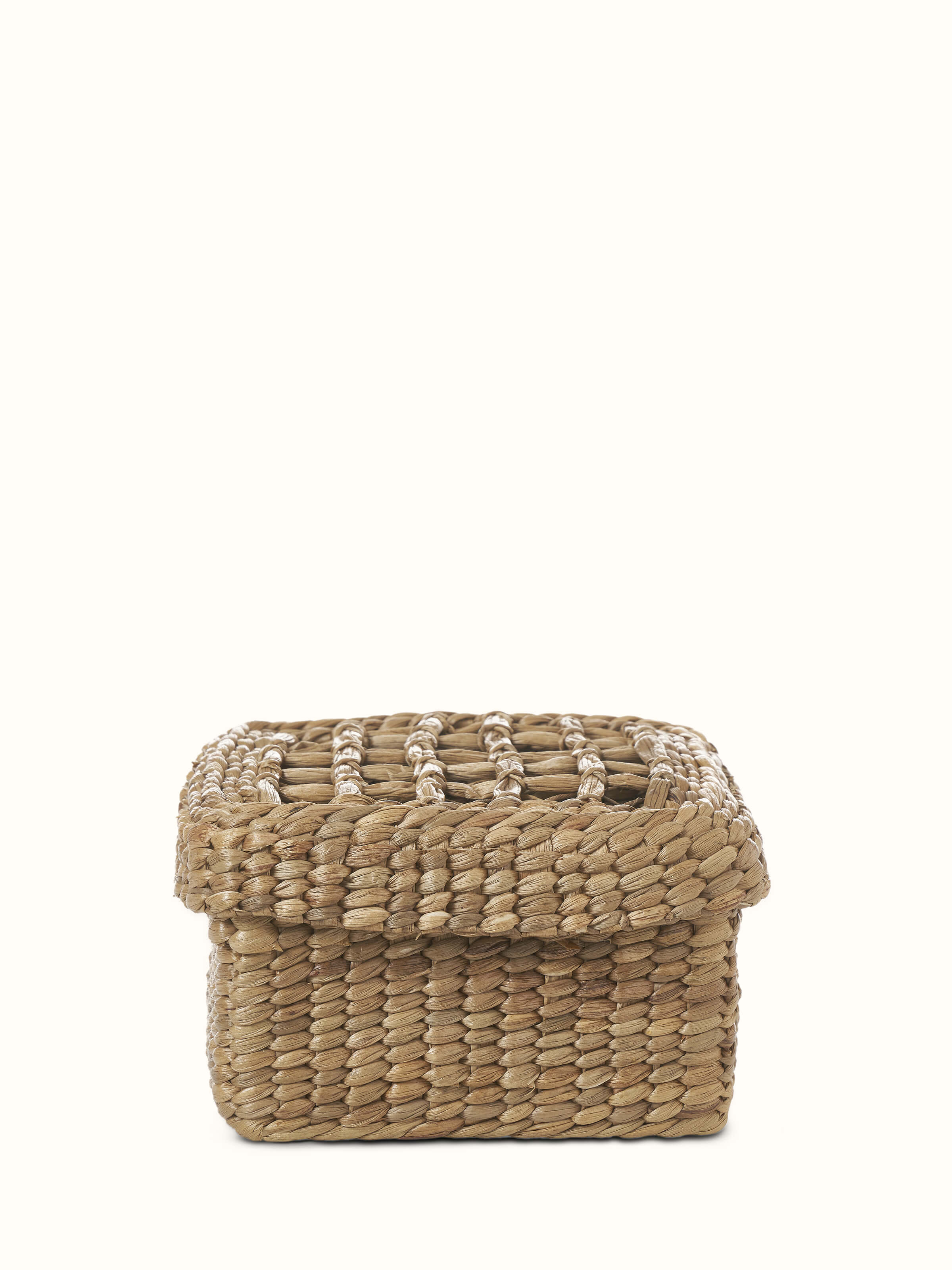 Front view of natural water hyacinth fibre storage basket, highlighting the texture and design.