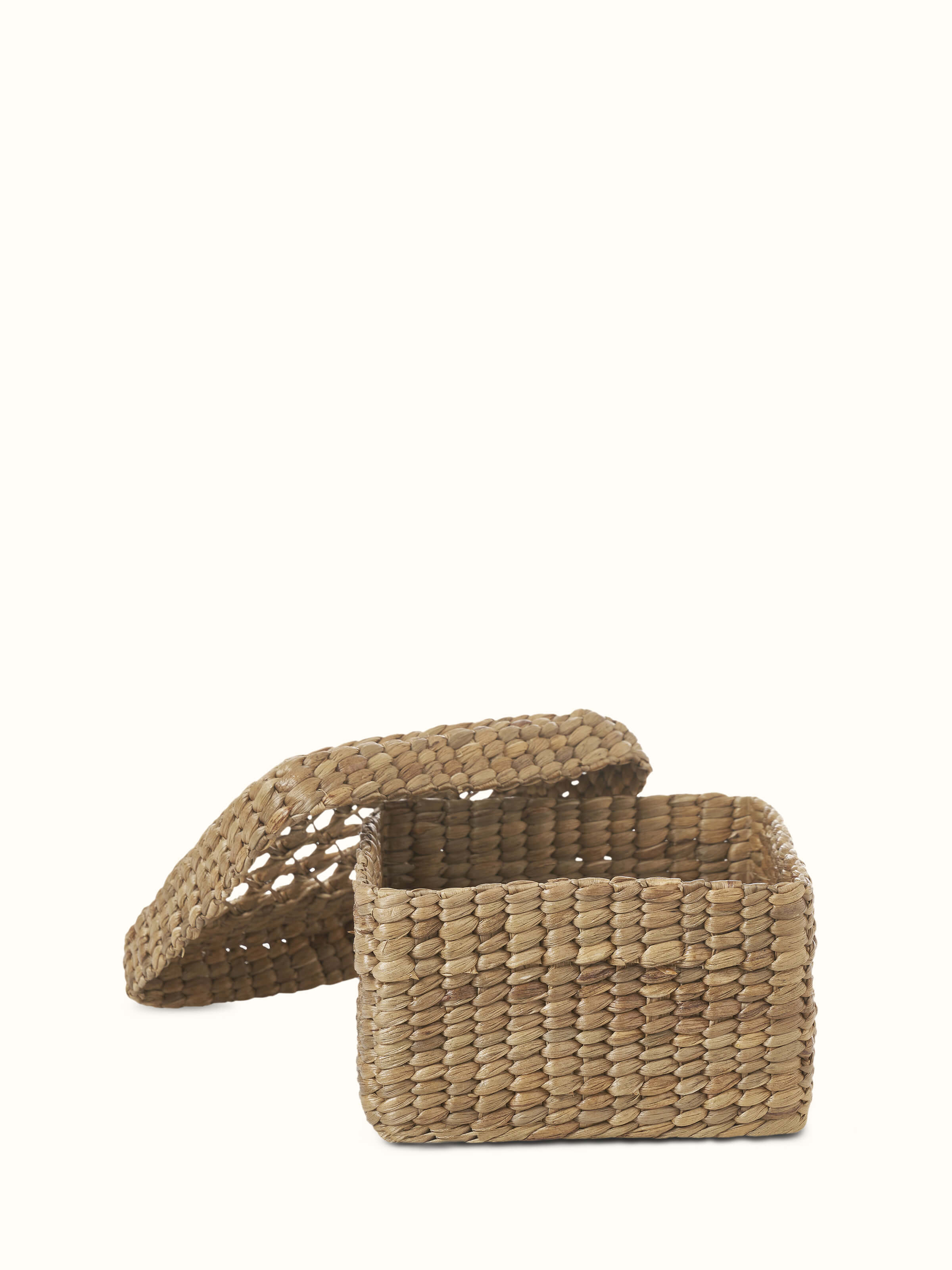 Close-up view of natural water hyacinth fibre storage basket, focusing on the material and texture.