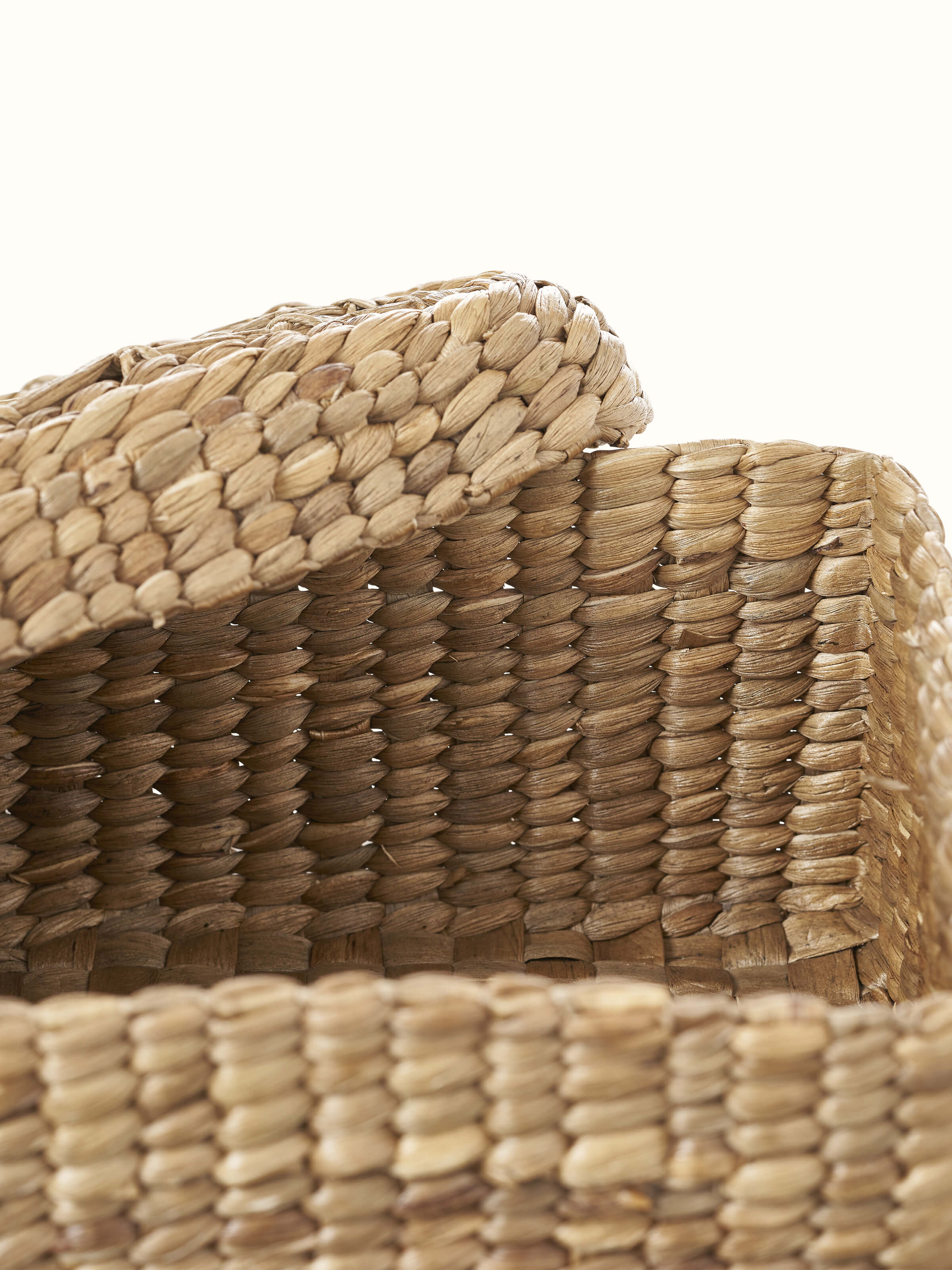Artistic view of natural water hyacinth fibre storage basket, highlighting the design and features.
