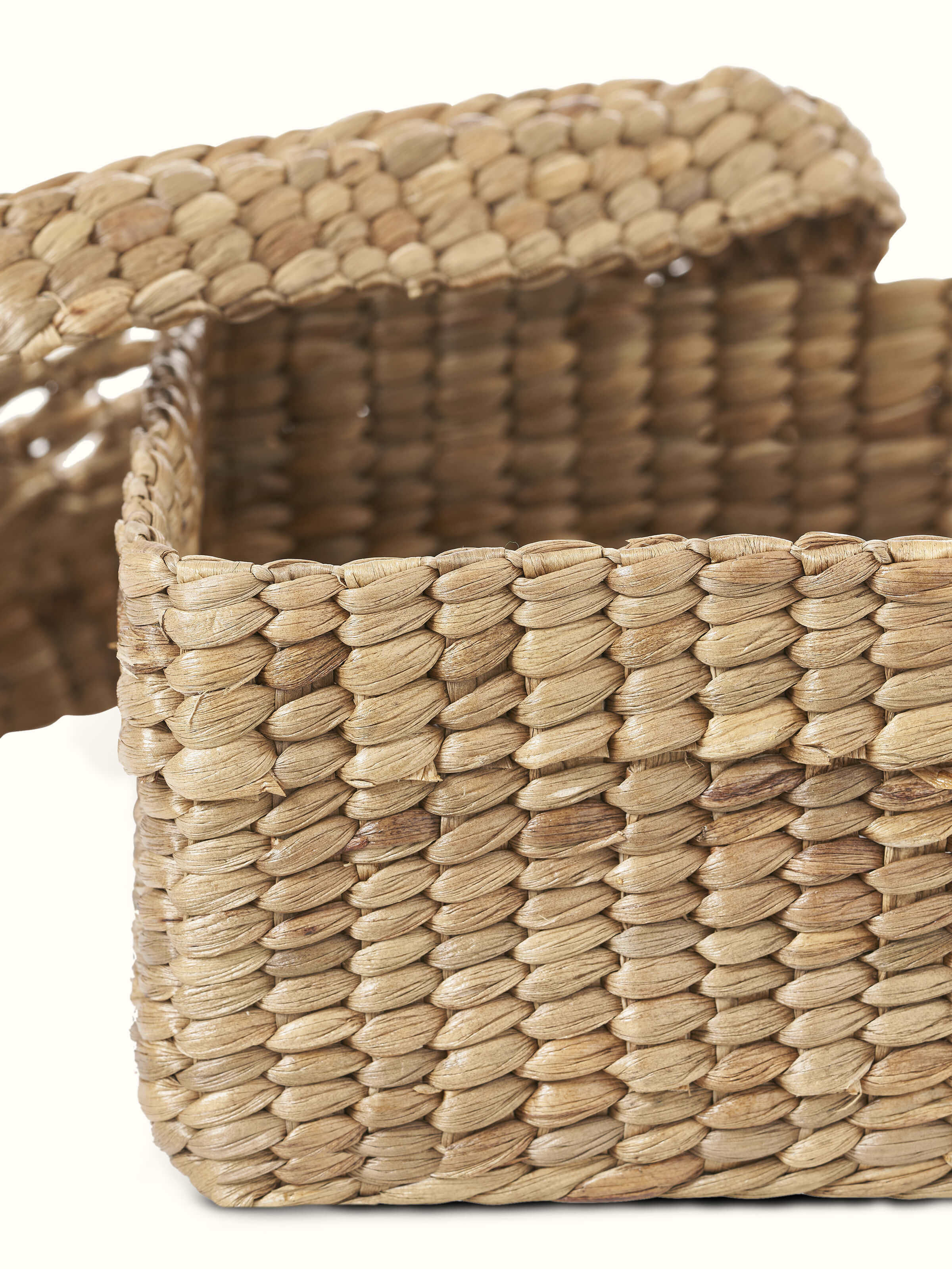 Detailed view of natural water hyacinth fibre storage basket, showcasing the construction and design.