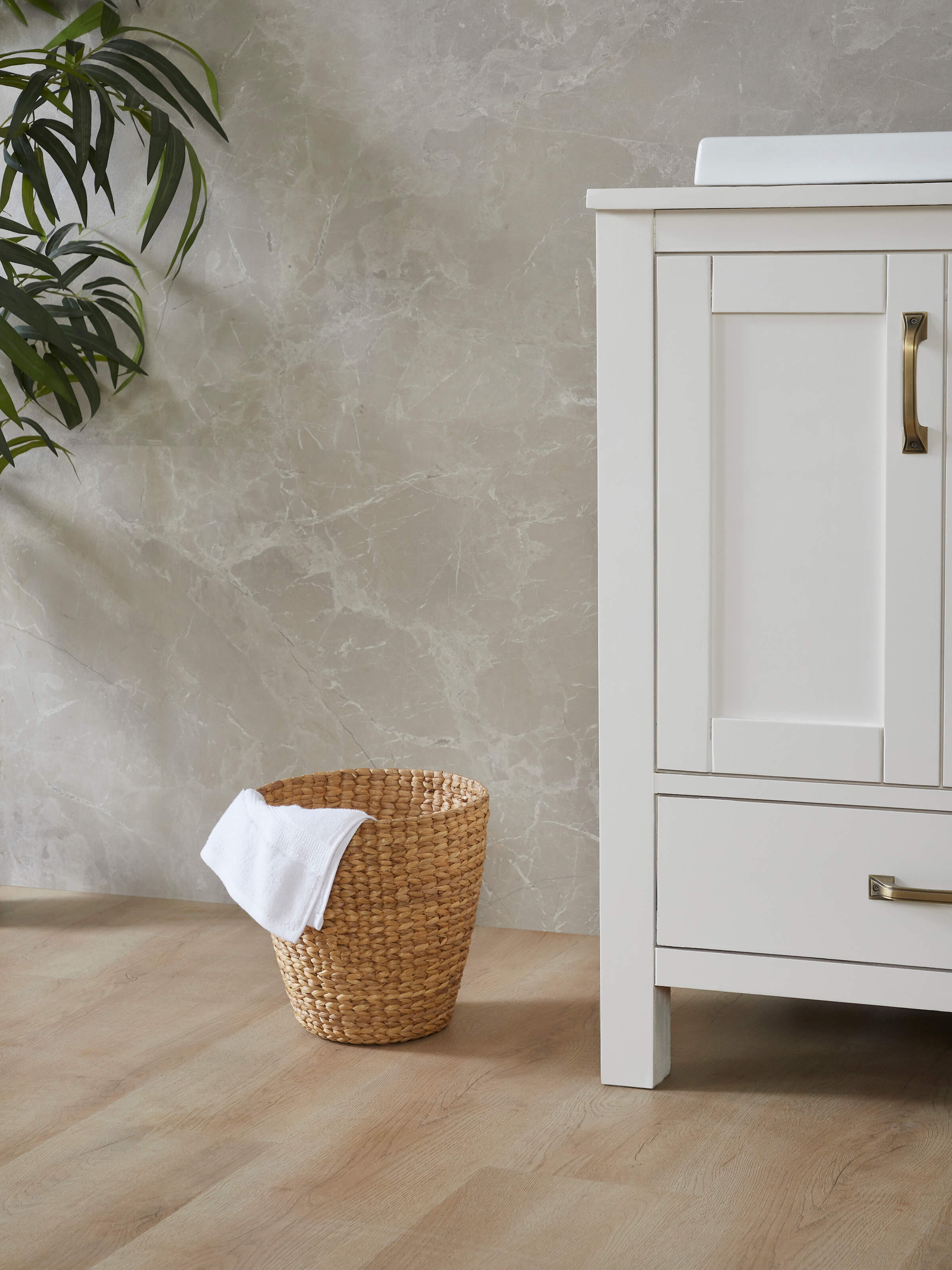Side view of Natural water hyacinth fibre waste bin showing the natural fiber weave and compact design