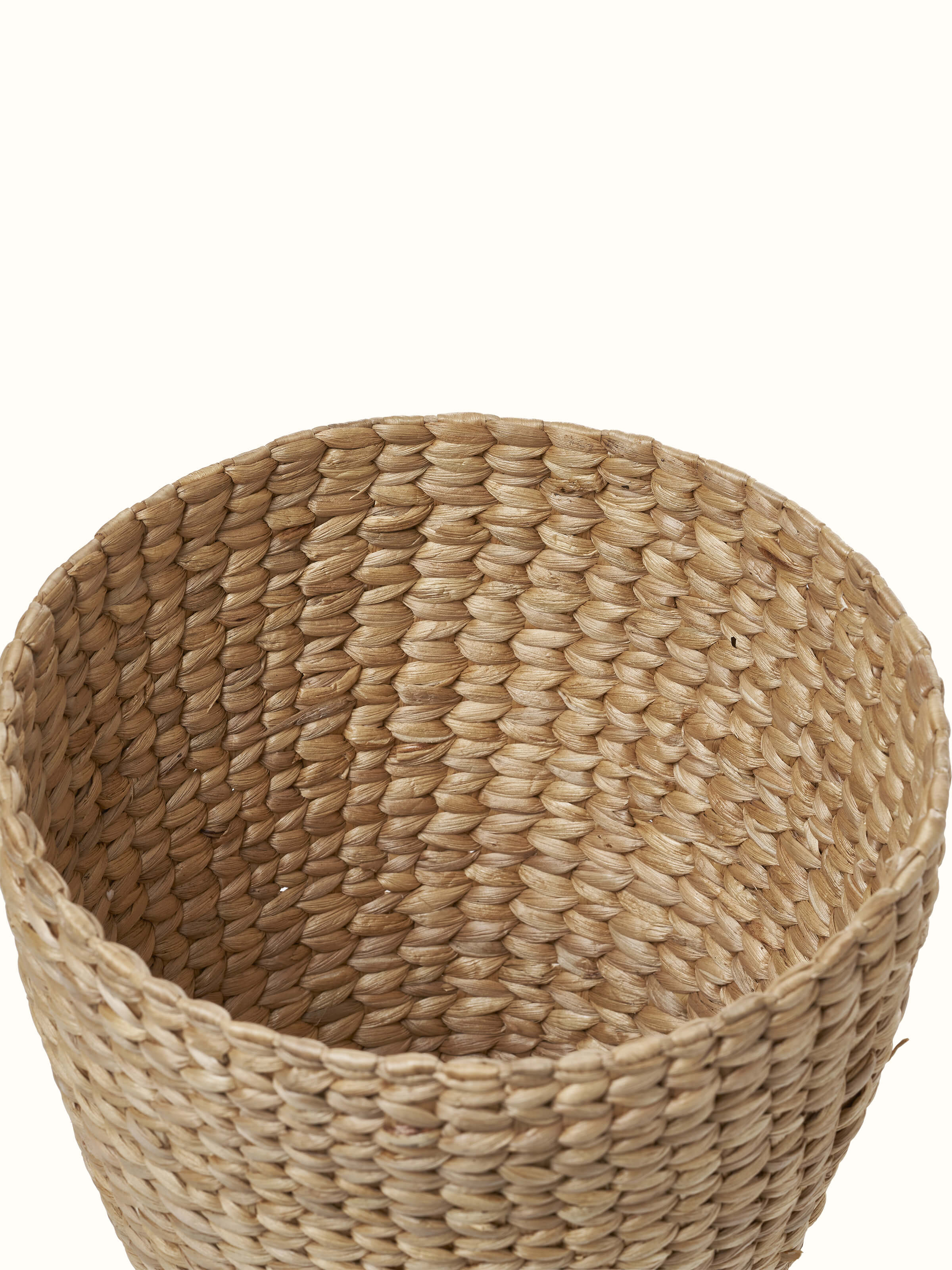 Close-up view of Natural water hyacinth fibre waste bin emphasizing the fine weave and natural material finish