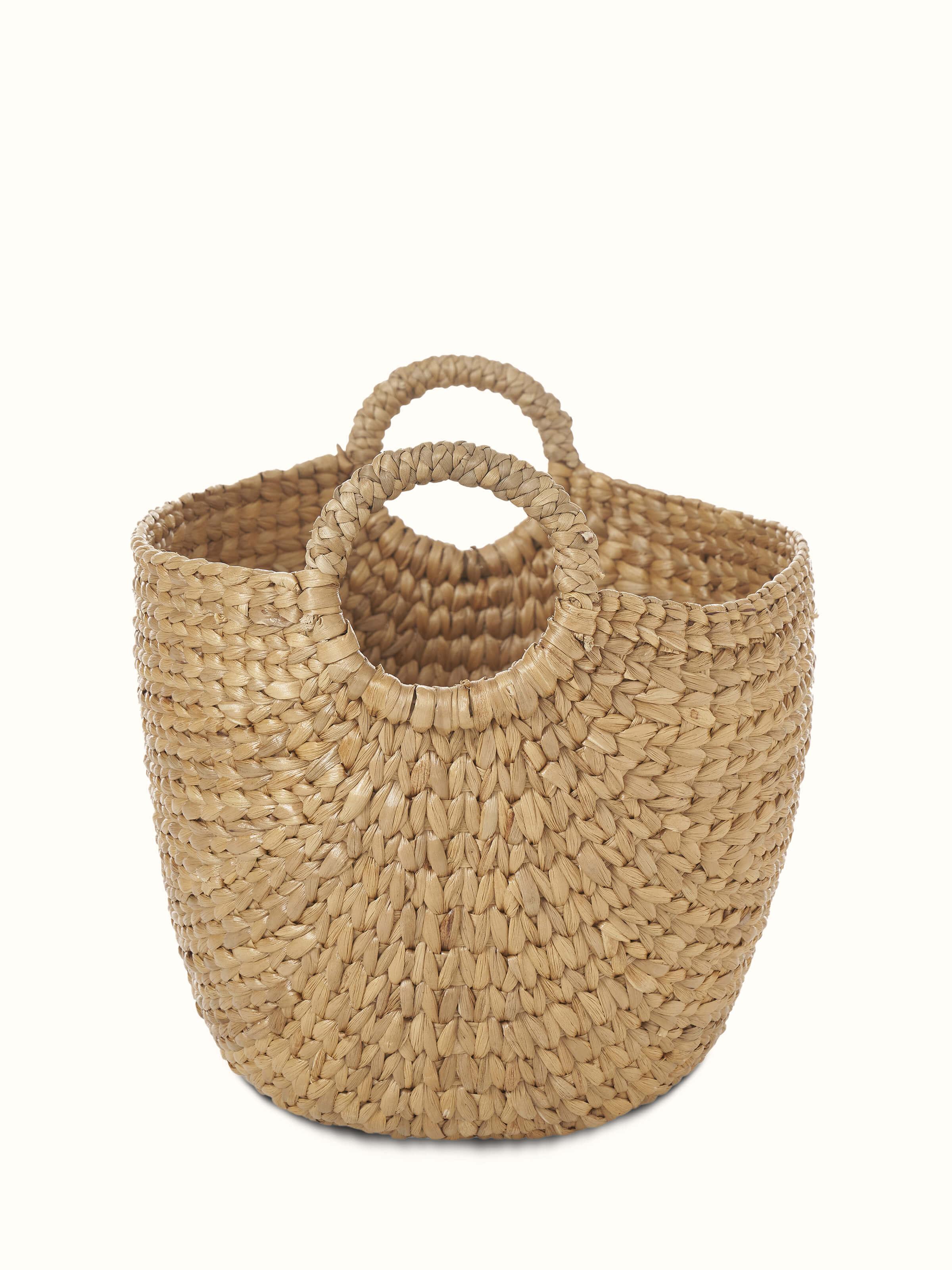 Angled view of Matte natural water hyacinth fibre storage organiser displaying its practical design and natural finish.