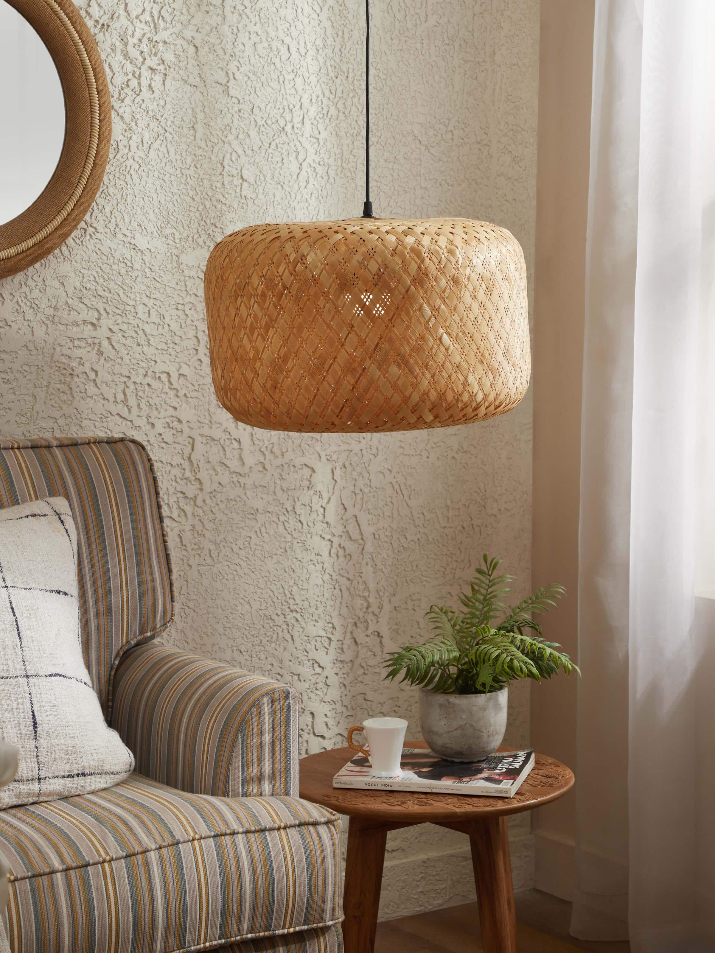 Side view of large bamboo LED pendant light highlighting its modern design and bamboo construction