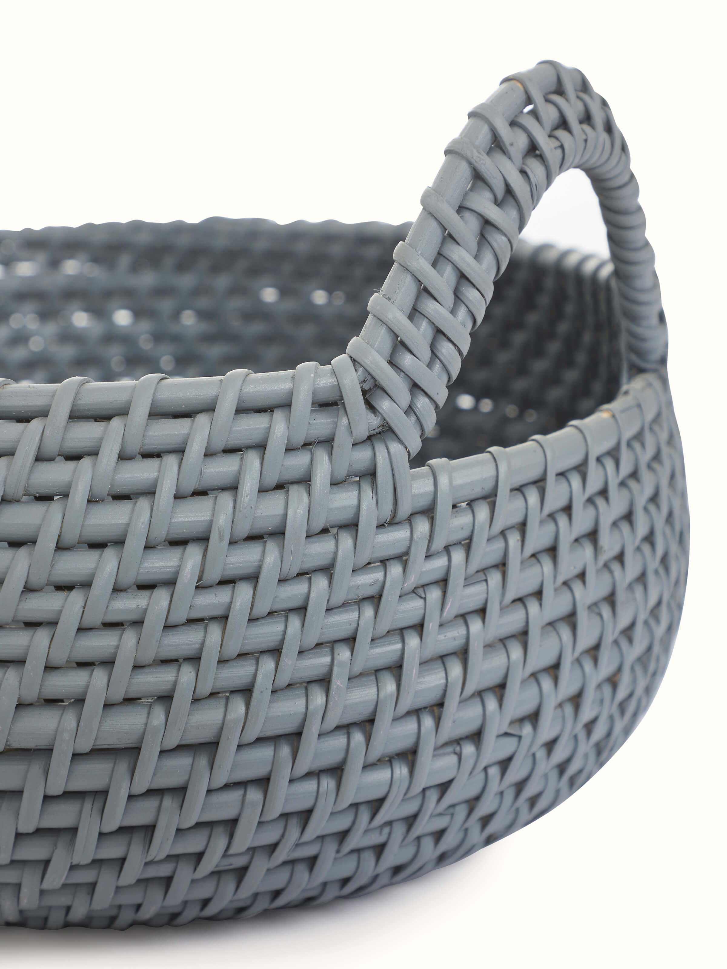 Full view of Cane decorative apple basket in grey color showing overall shape and design.