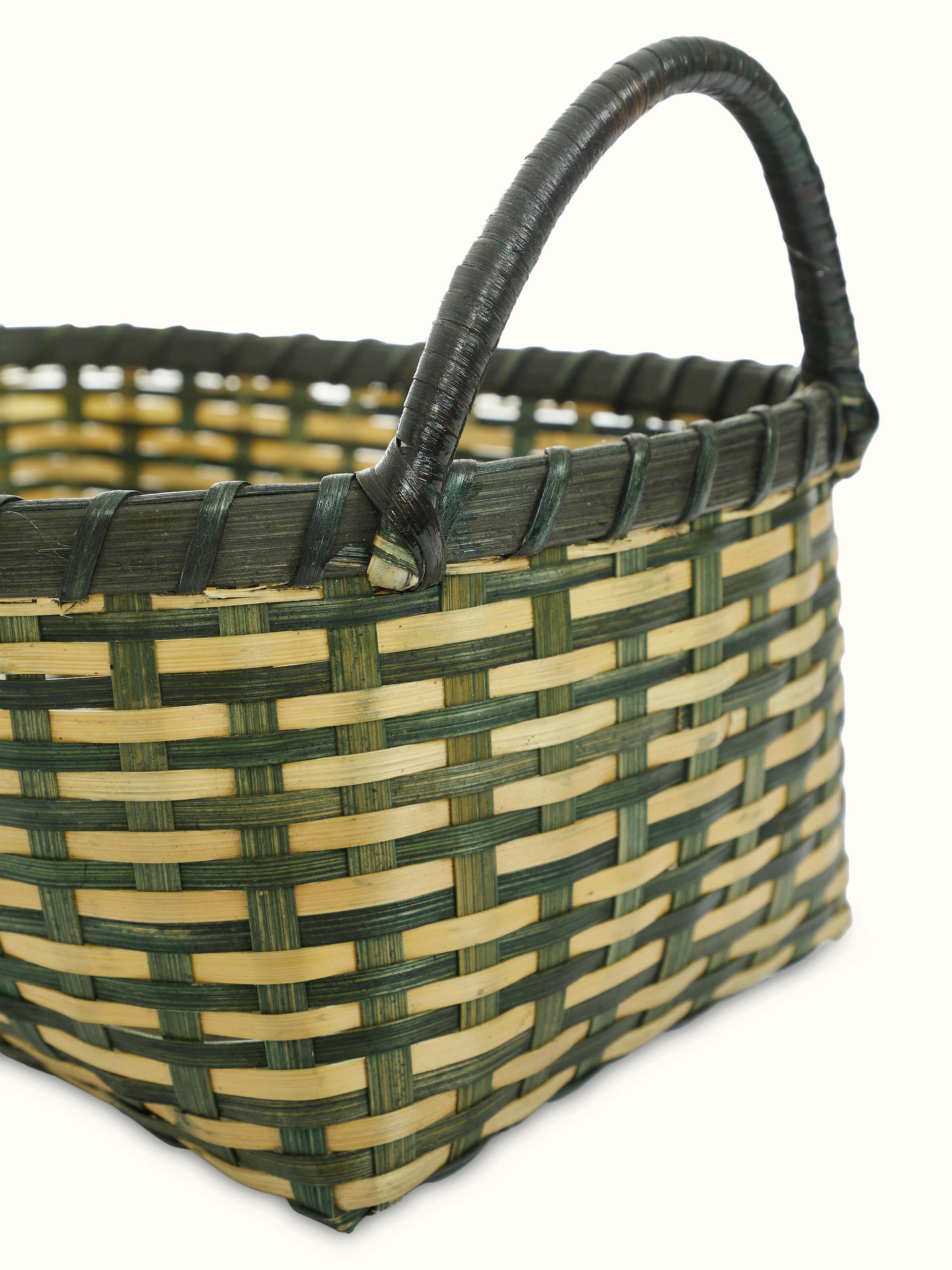 Detailed view of bamboo storage organiser in green, showcasing the construction and storage features.