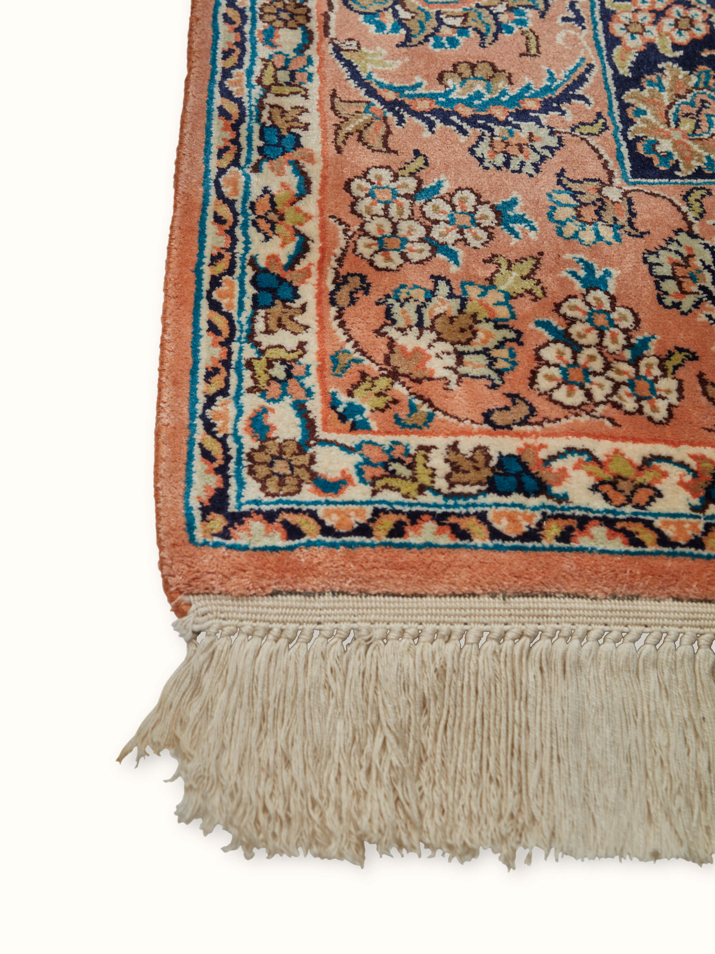 Close-up of Traditional Persian teal rust Kashan Kashmir silk hand-knotted carpet, highlighting the craftsmanship