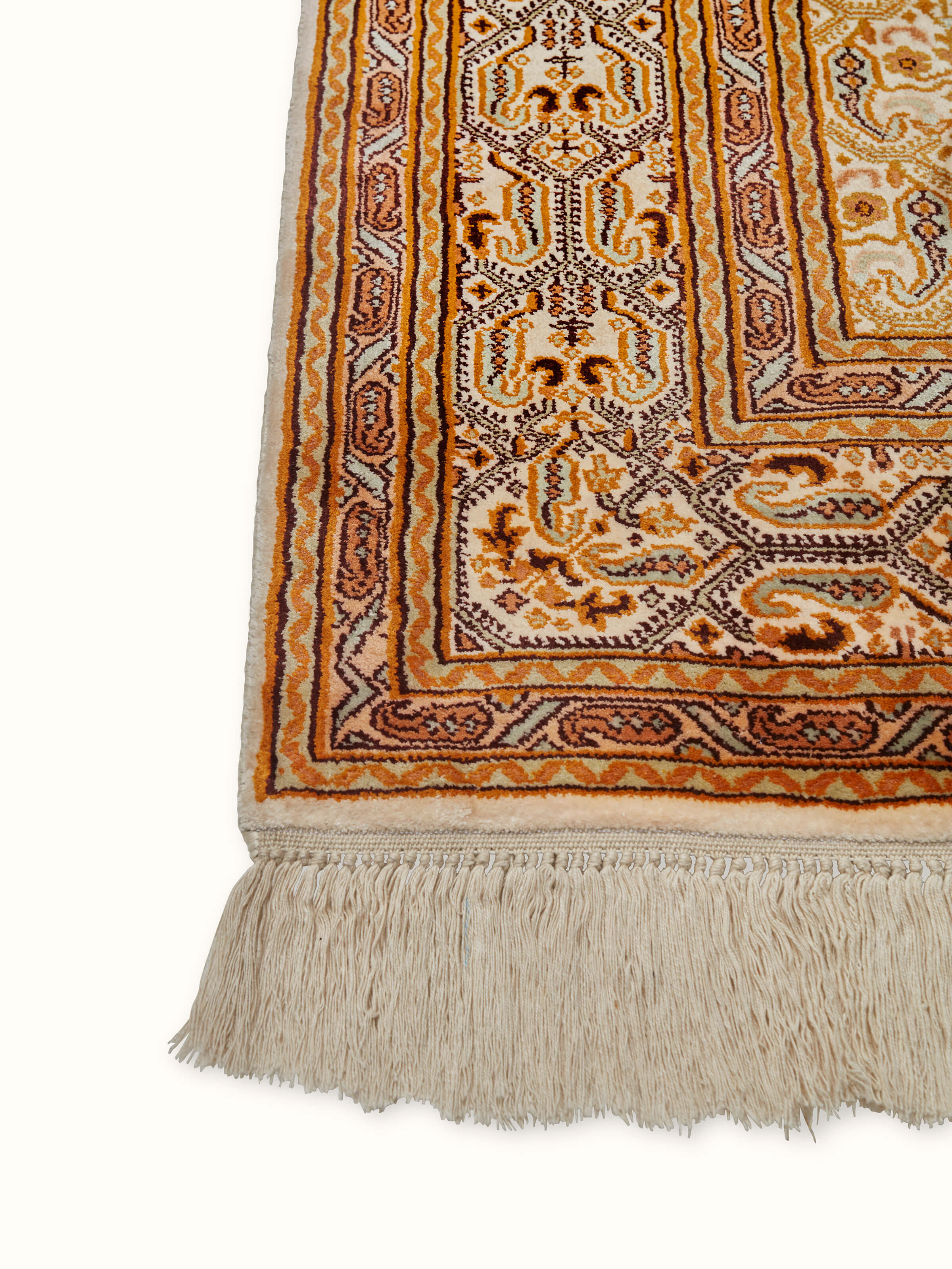 Angle view of Traditional Persian Ivory Senna Kashmir Silk Hand-Knotted Carpet highlighting the detailed design and fine craftsmanship