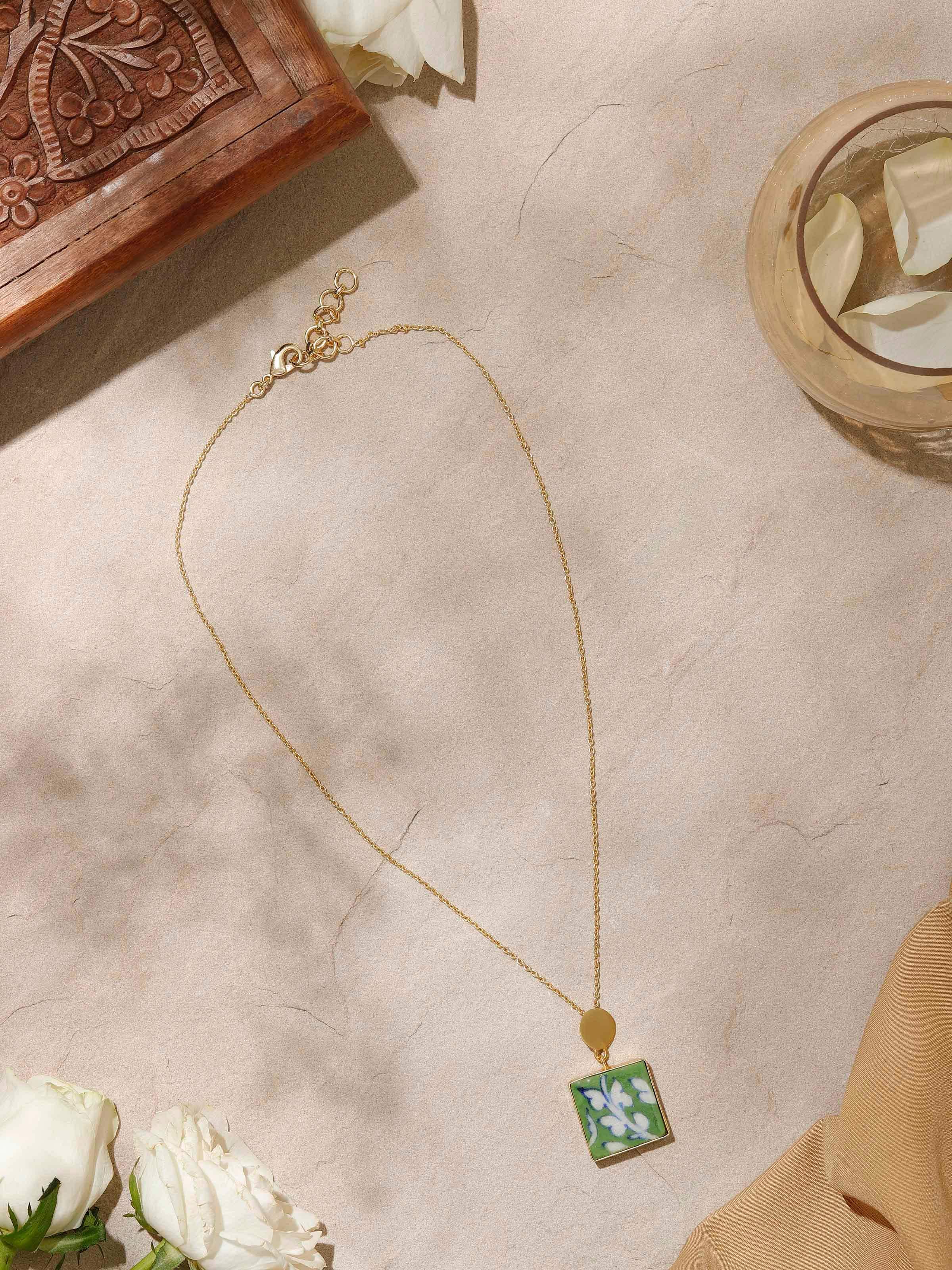 Side view of Blue Pottery Pendant & Chain showing the pendant's artistic design and chain length