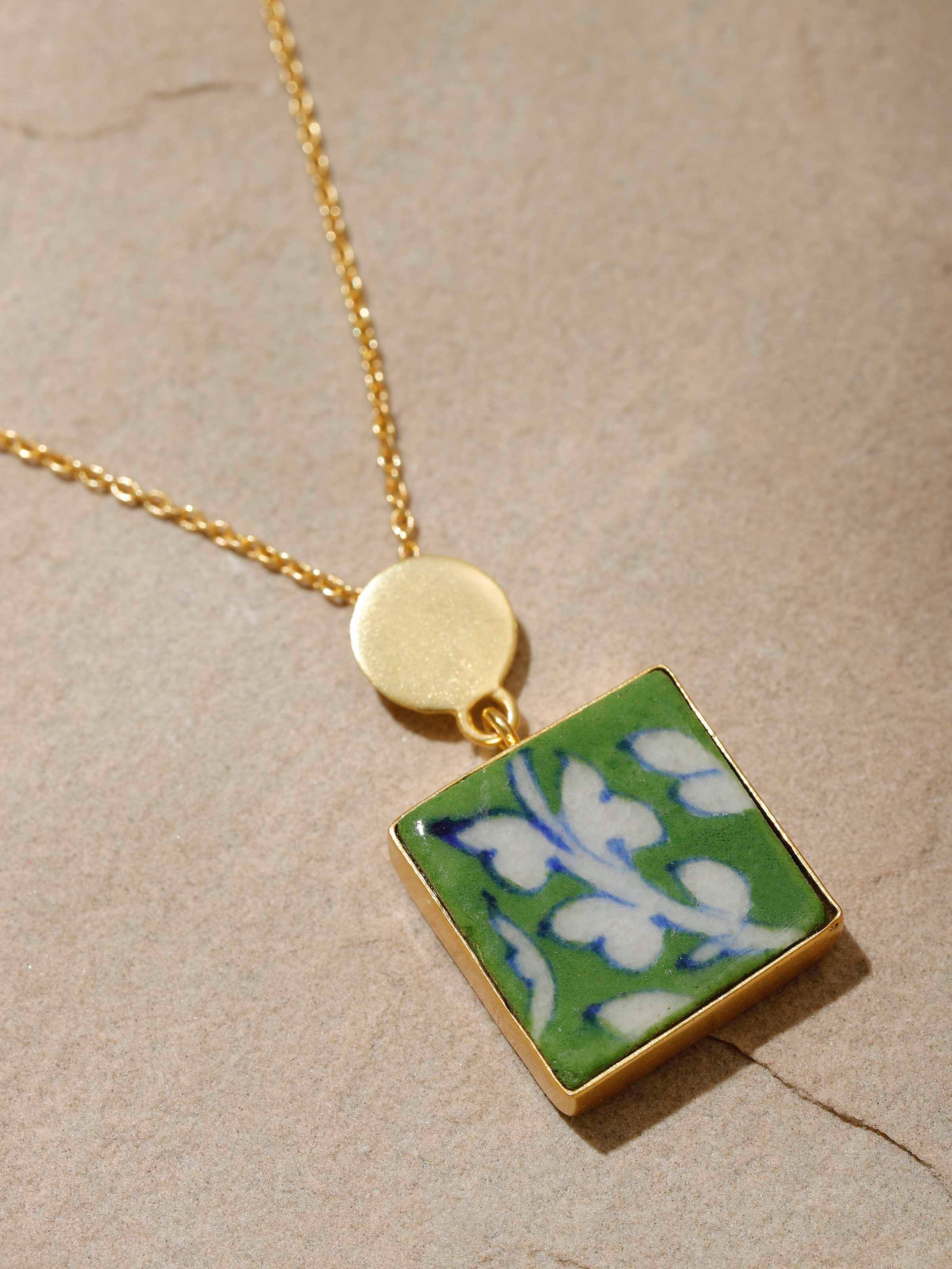 Detailed view of Blue Pottery Pendant & Chain showcasing the texture and craftsmanship of the pottery